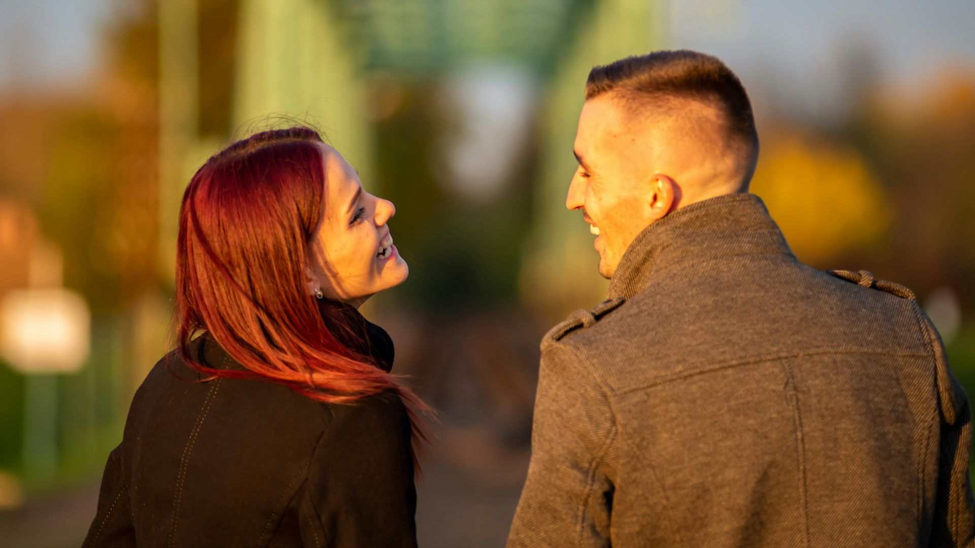 man and woman standing side by side during daytime