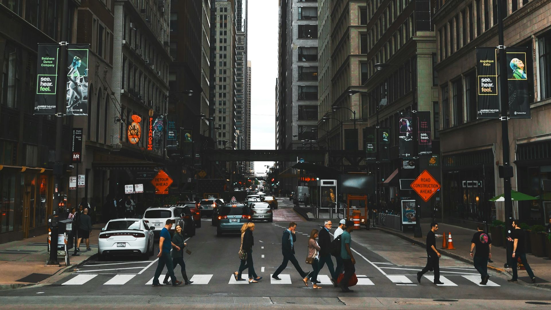 people crossing road during daytime