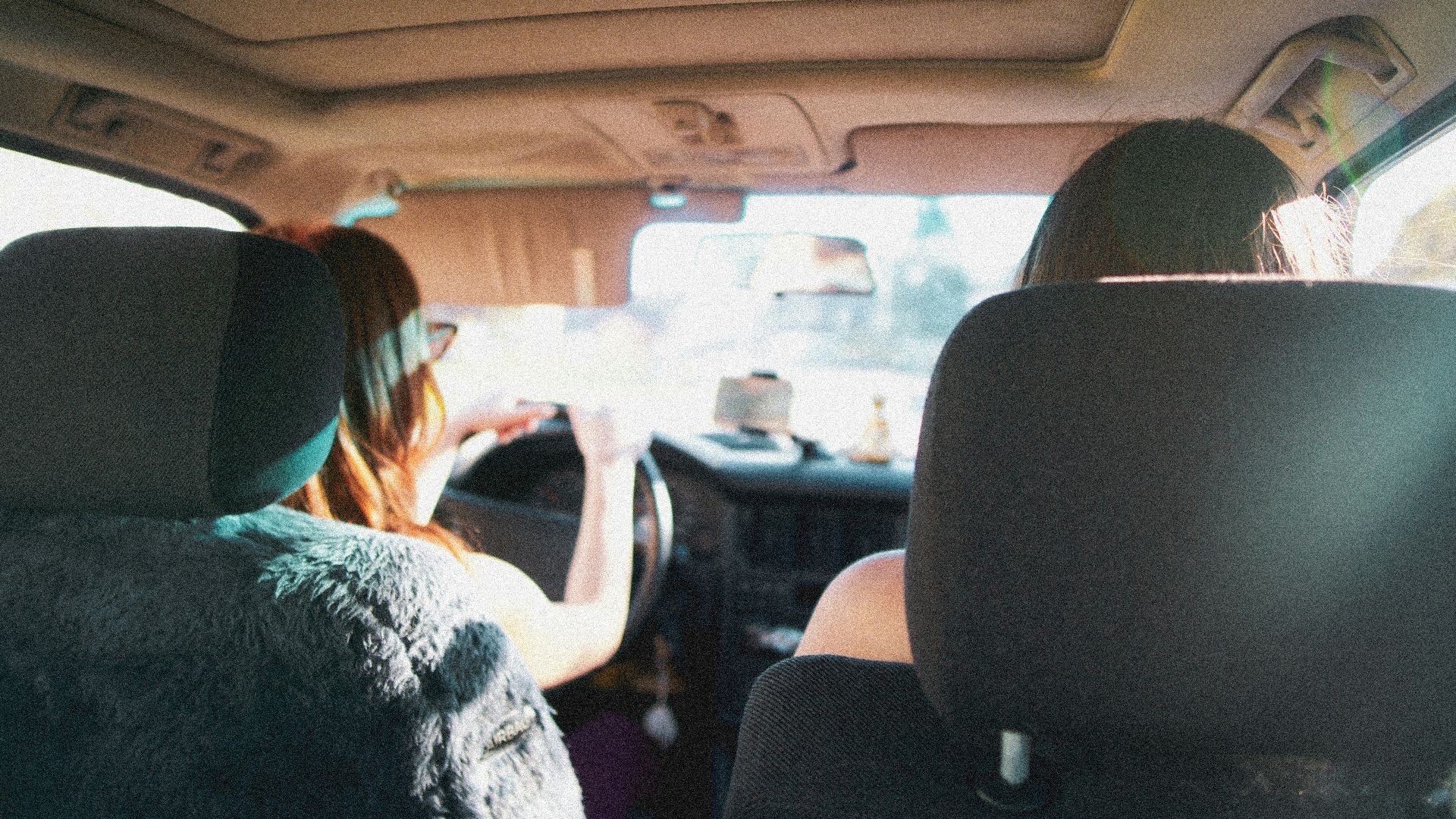 people sitting on car seat