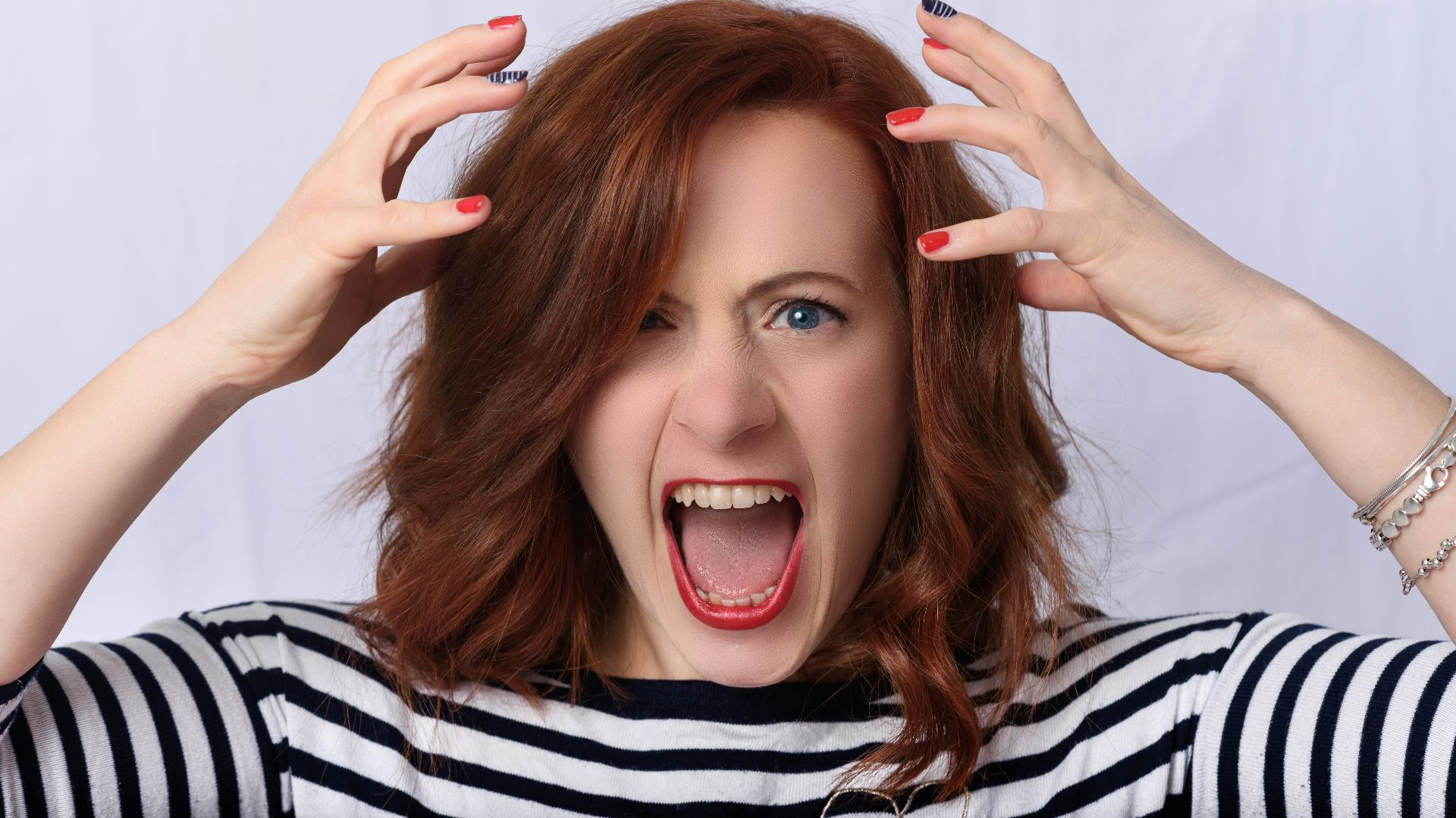 smiling girl in black and white striped shirt