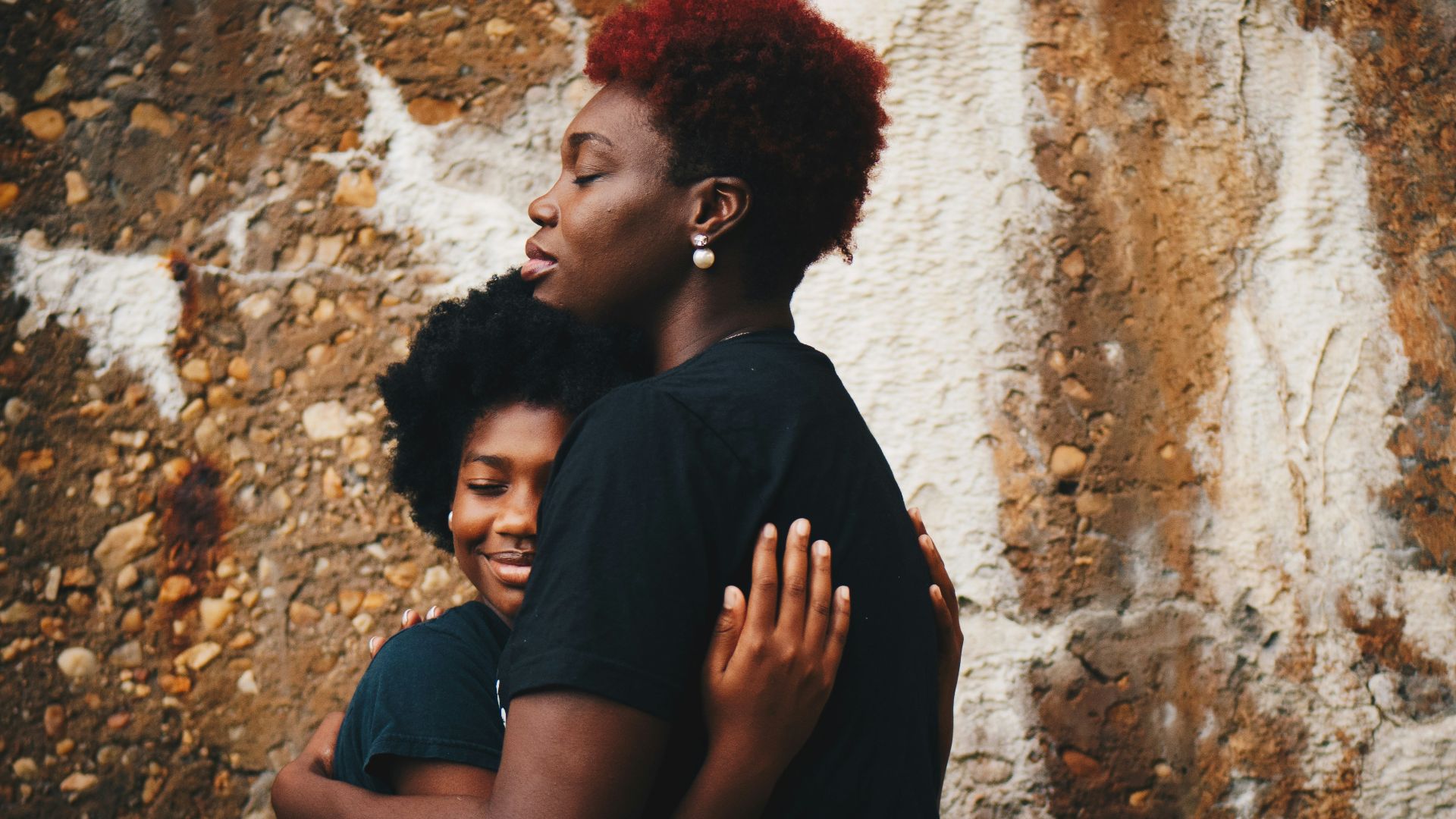 two women hugging each other