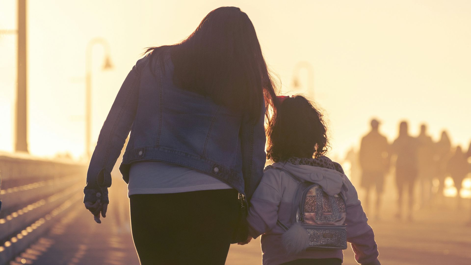 2 women walking on the road during daytime