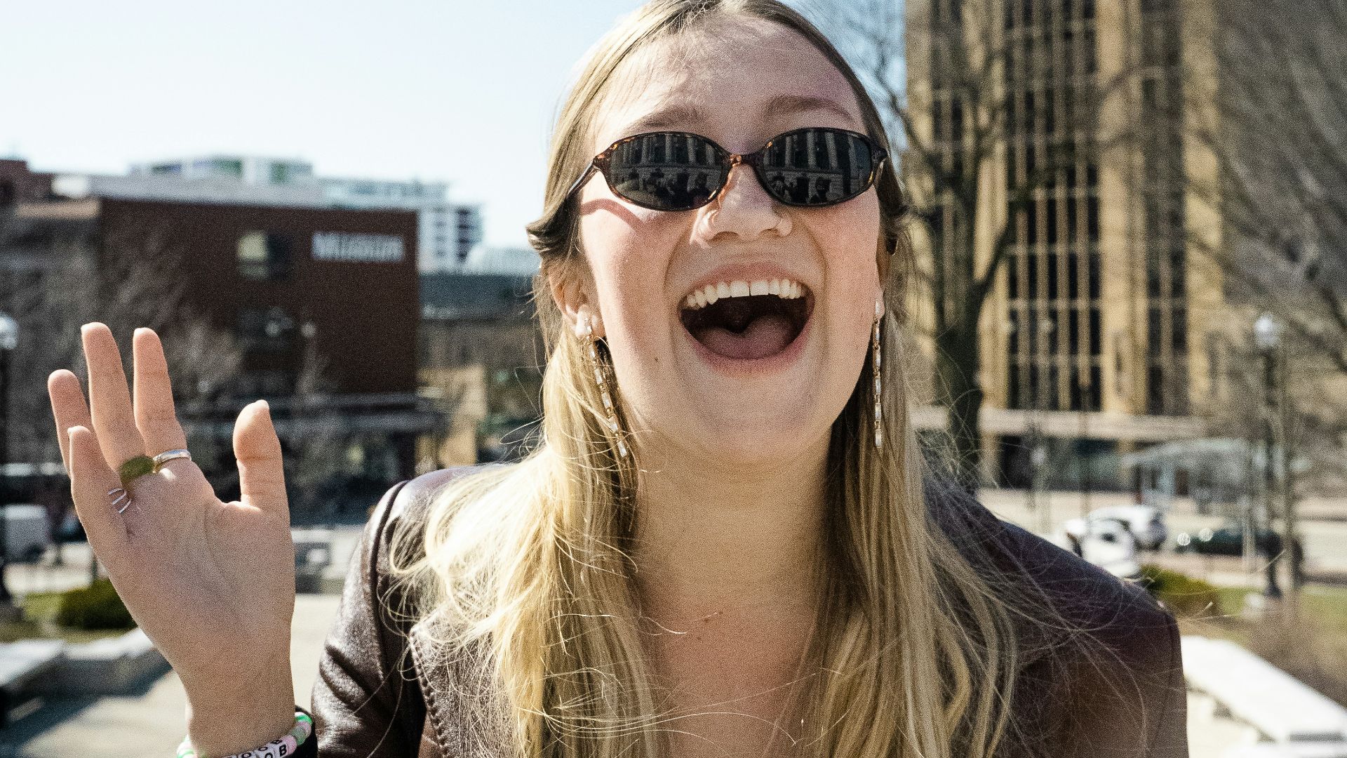 woman in brown sunglasses and brown shirt
