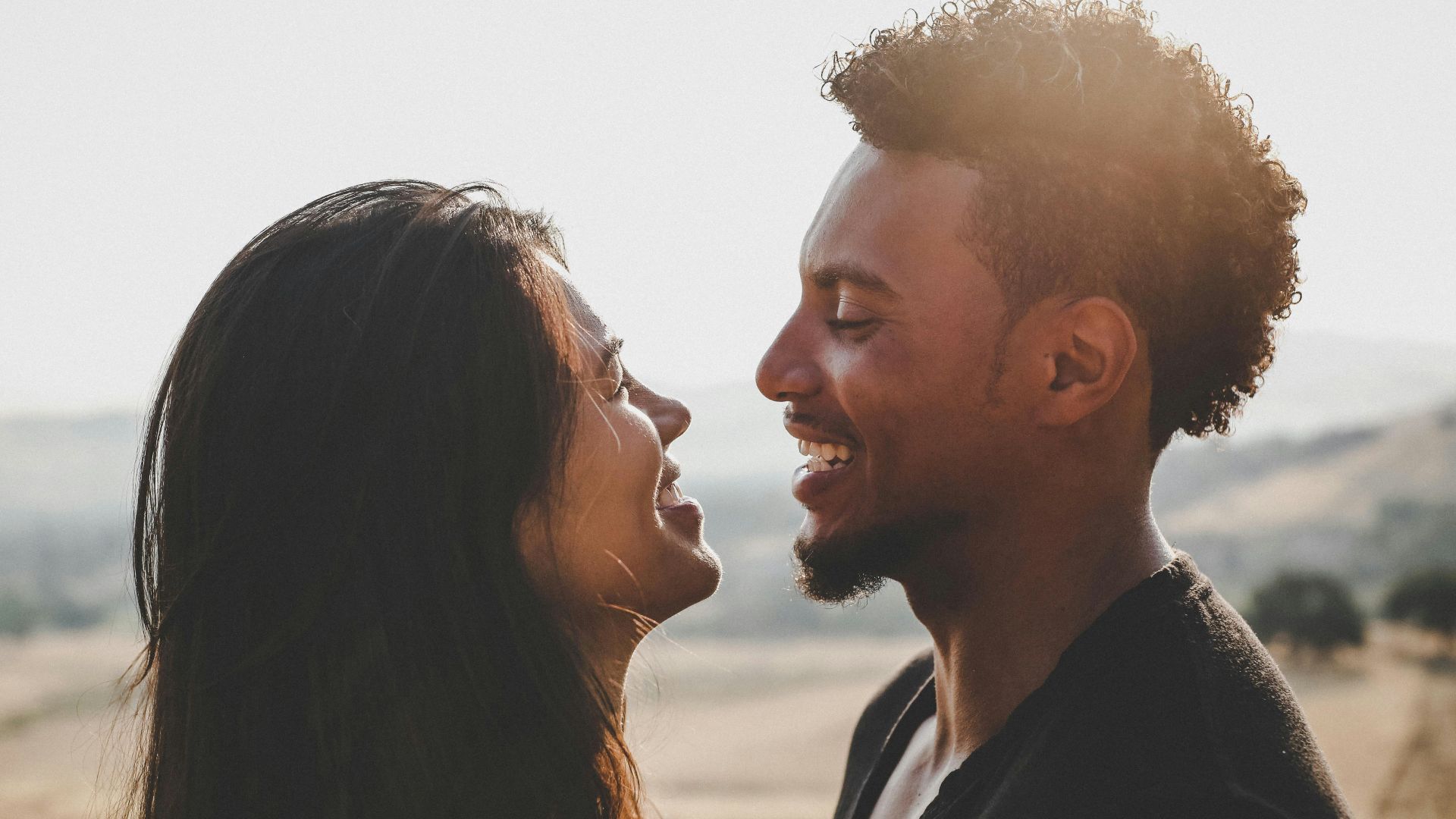 man and woman facing