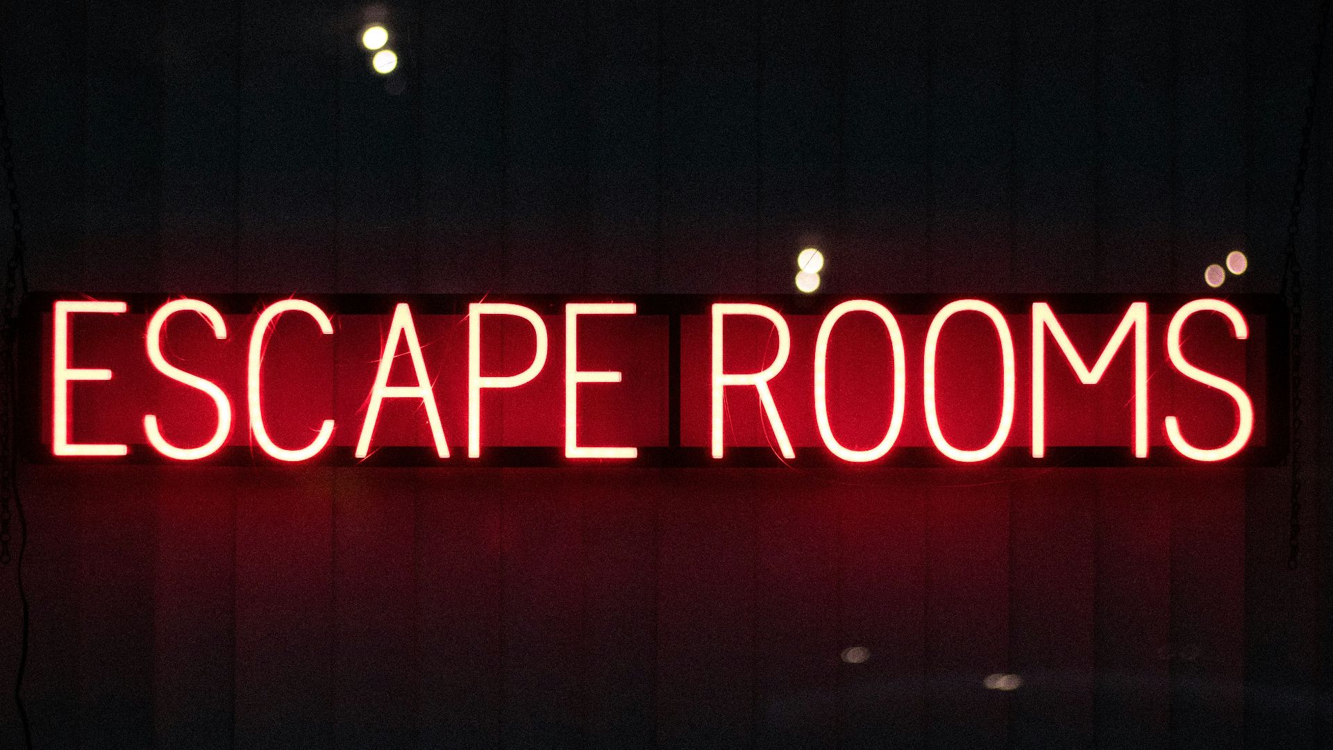 red escape rooms neon sign