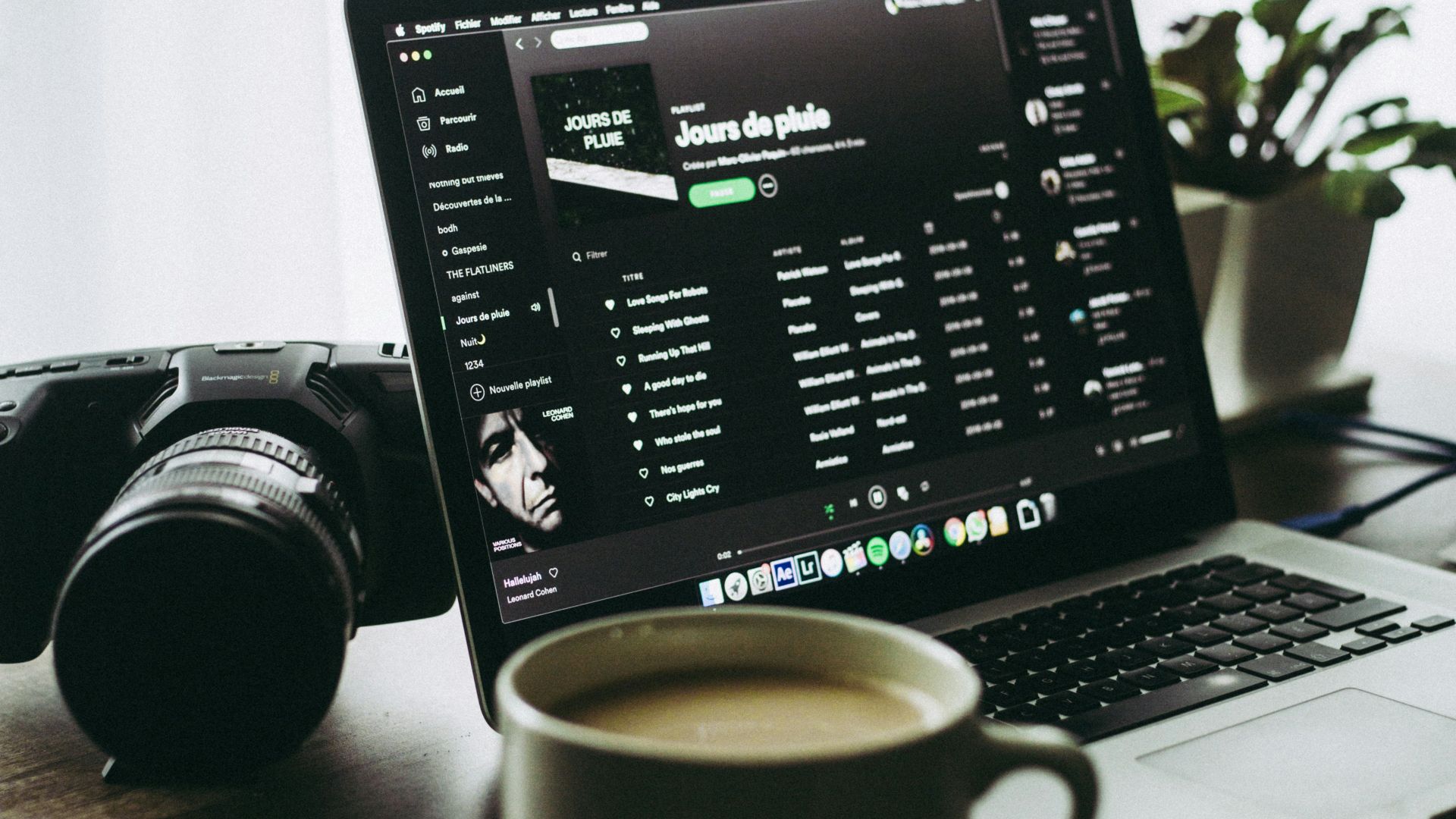 black and silver laptop computer beside white ceramic mug