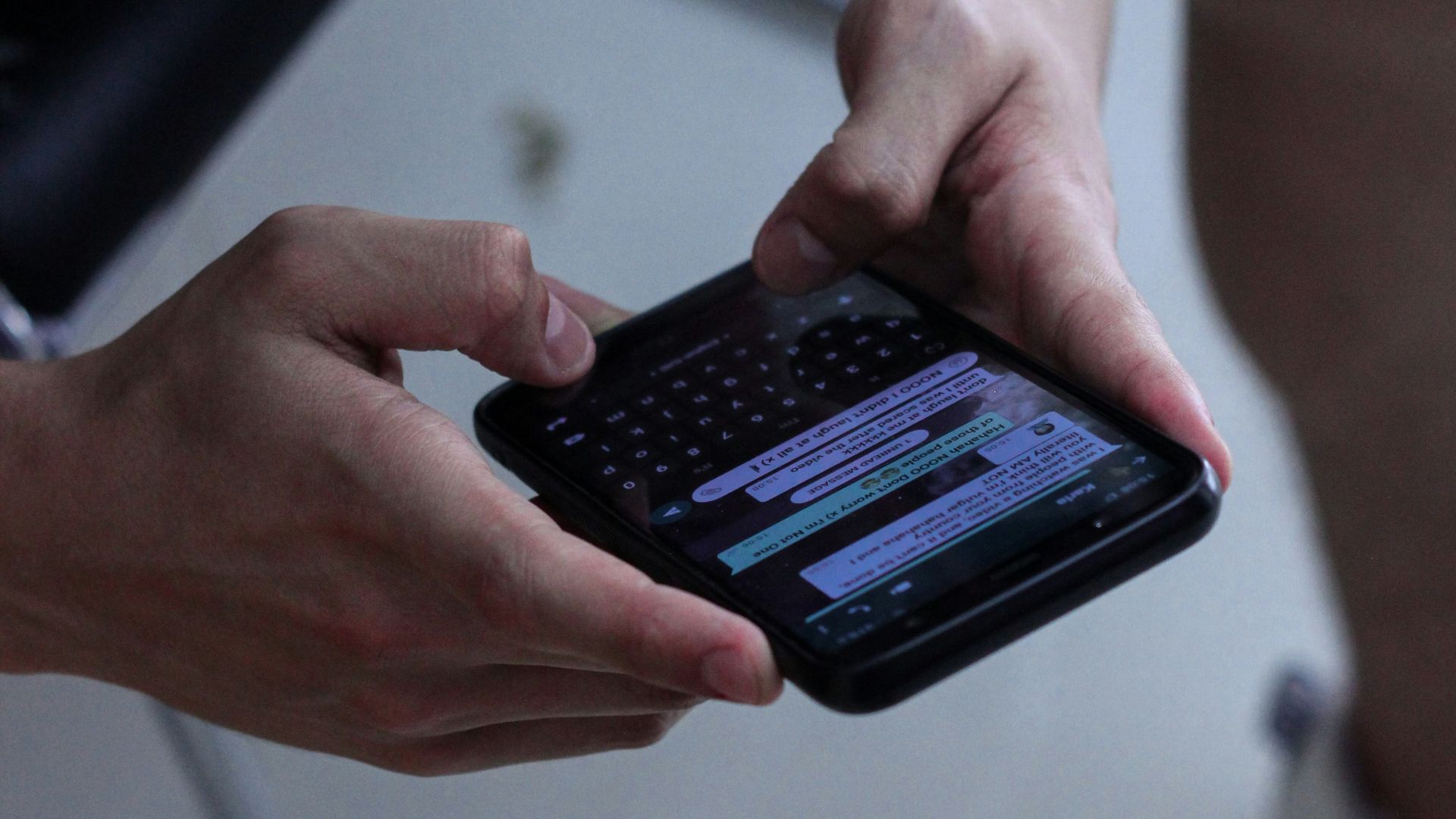 person holding black iphone 4