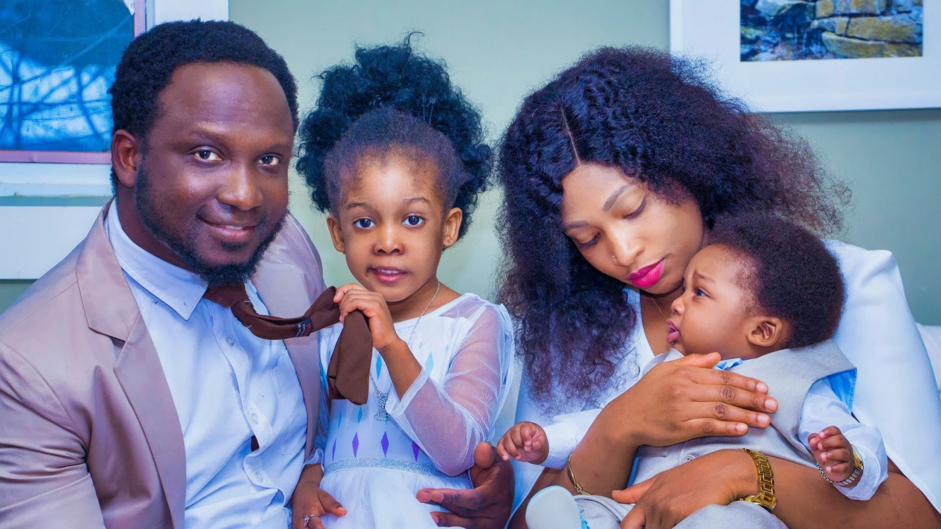 a man, woman, and child are posing for a picture