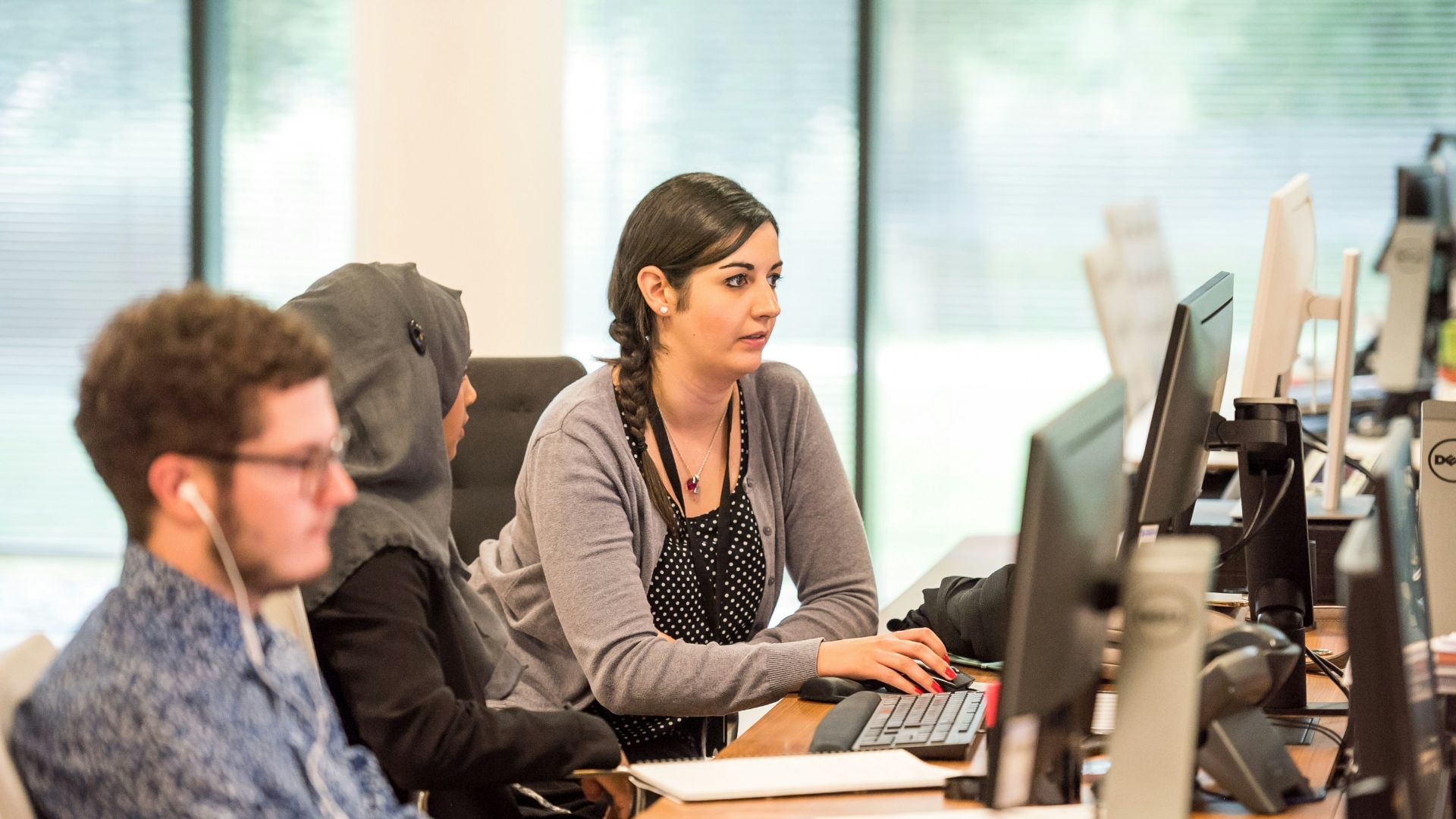 unknown persons using computer indoors