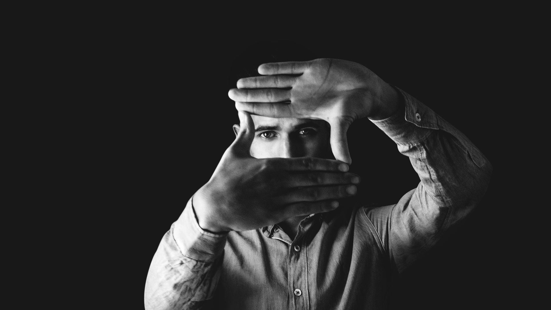 grayscale photography of man wearing dress shirt