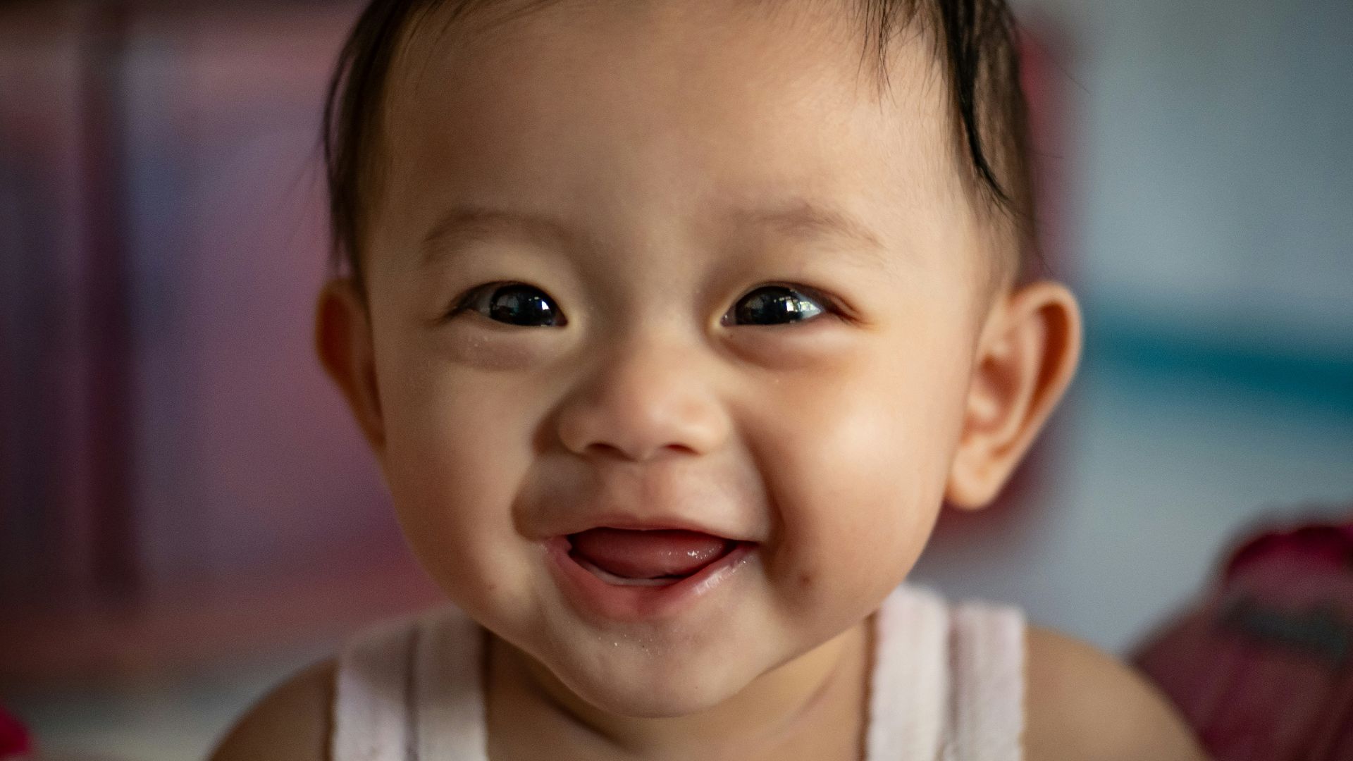 child in white tank top