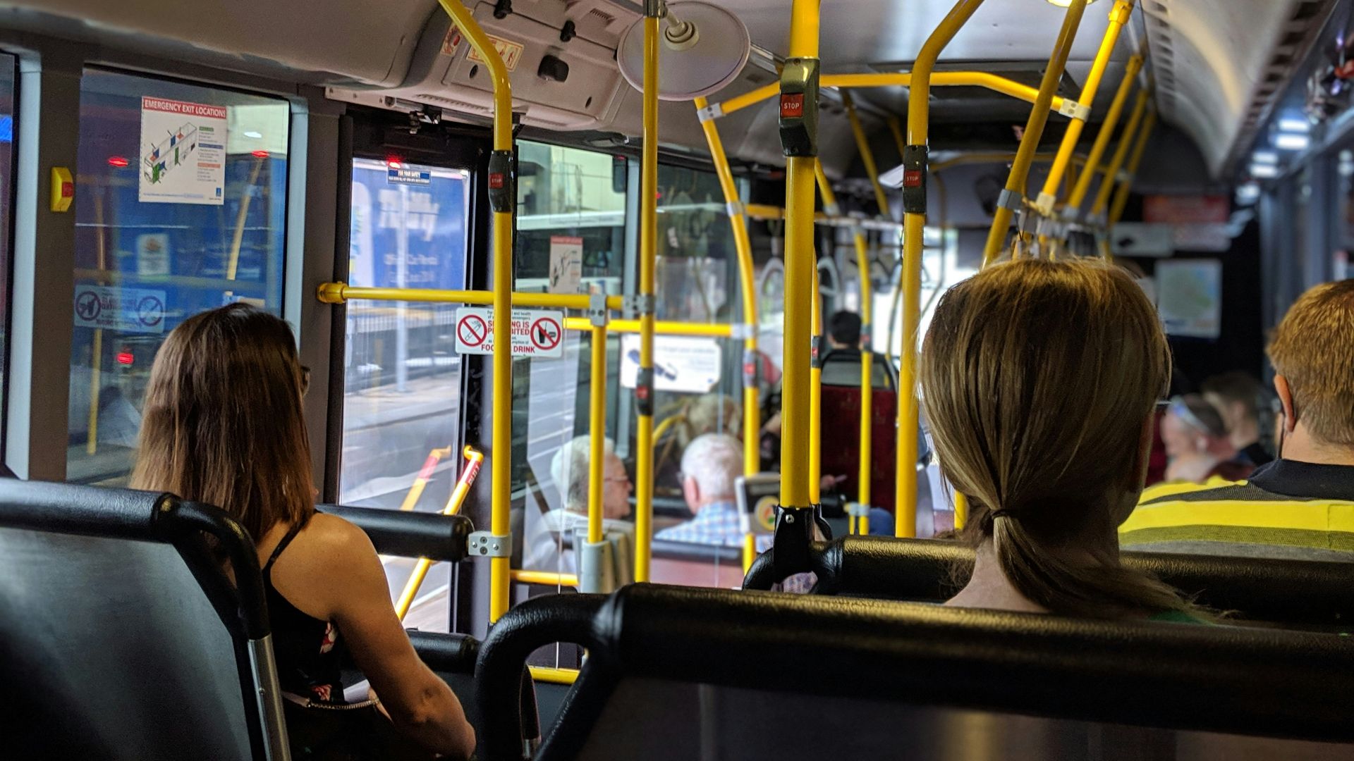 people sitting down inside vehicle