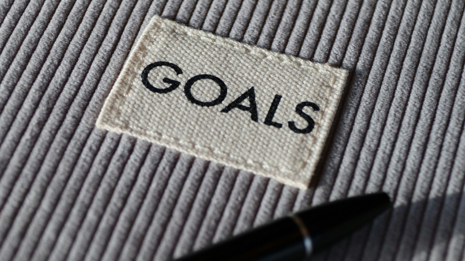 black and silver pen on gray textile