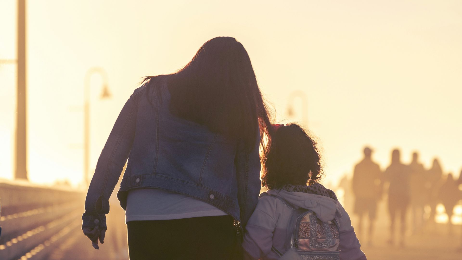 2 women walking on the road during daytime