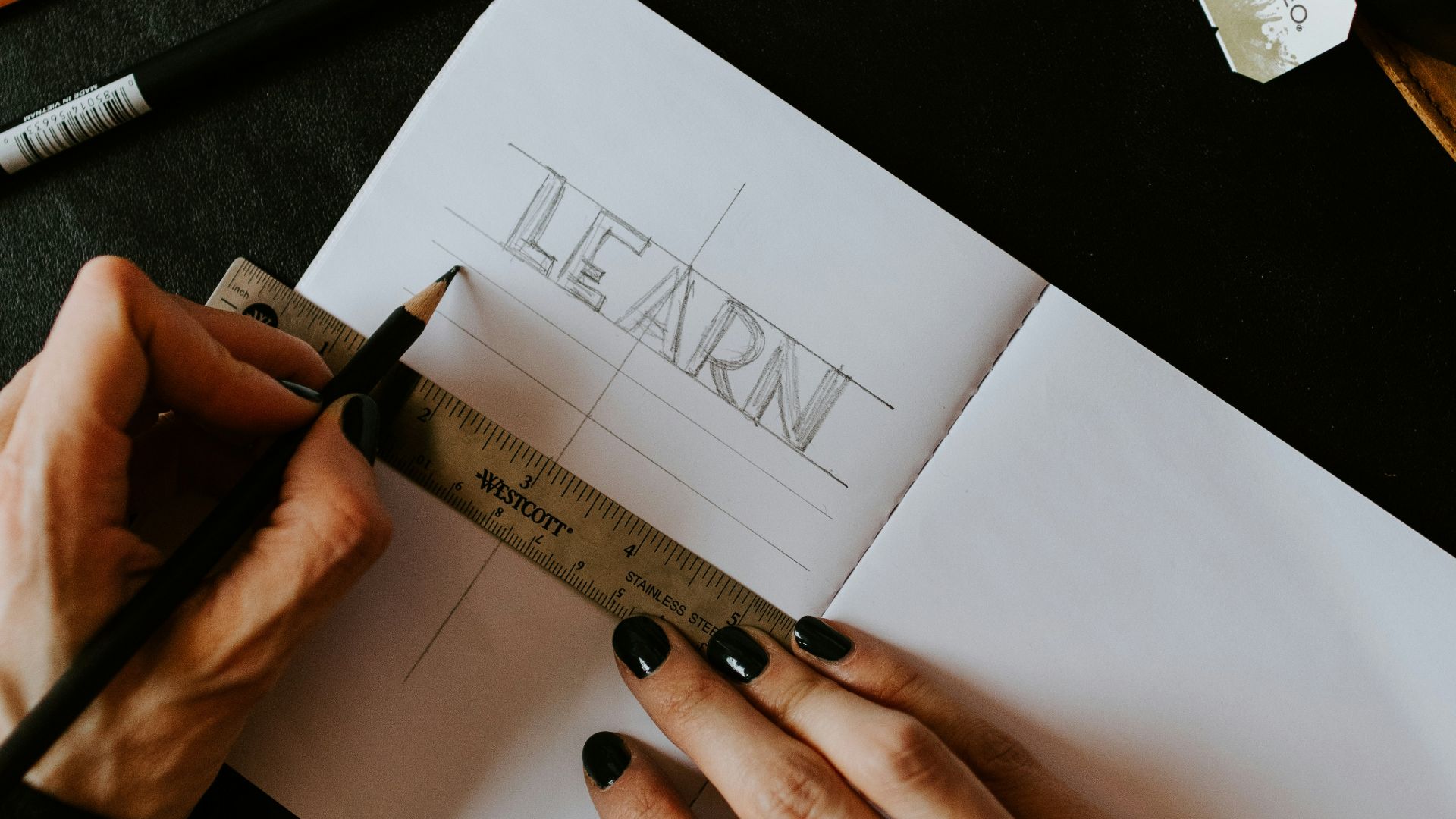 person writing on white paper