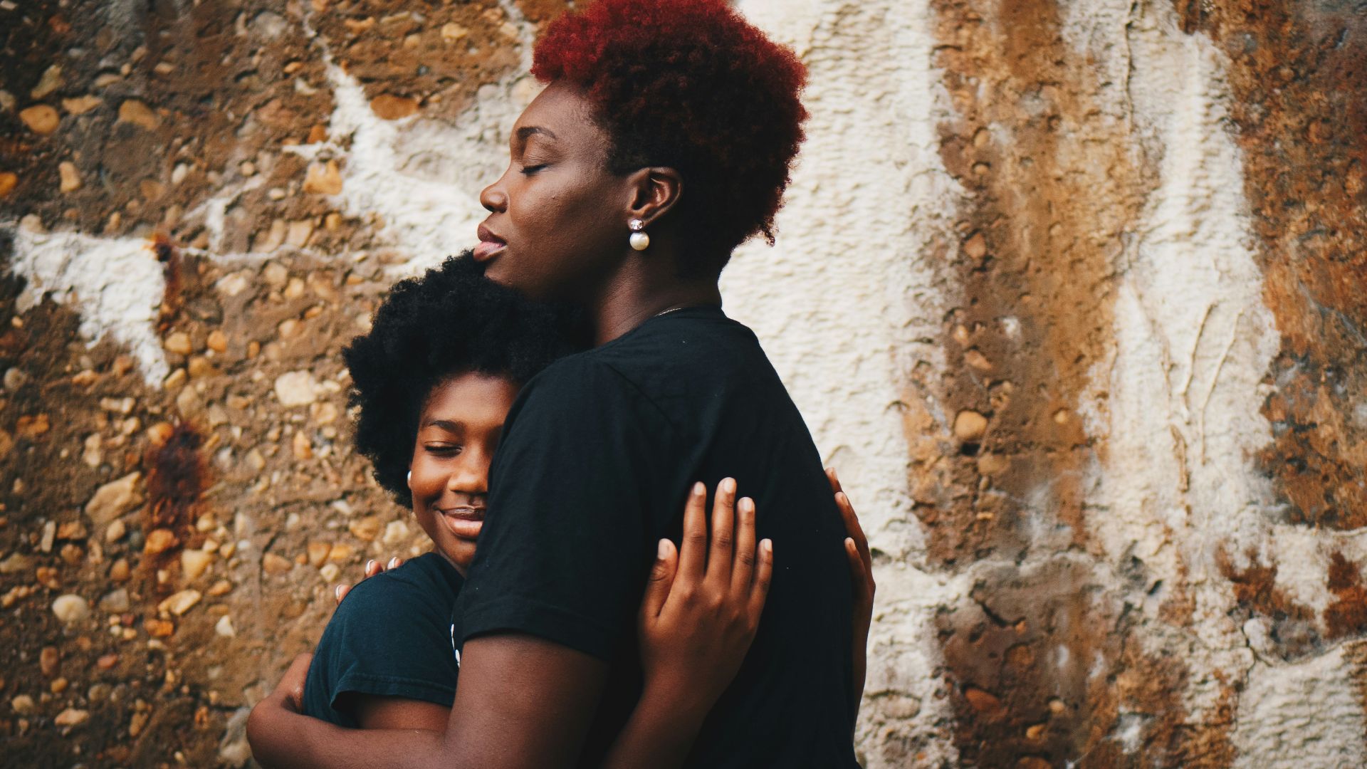 two women hugging each other