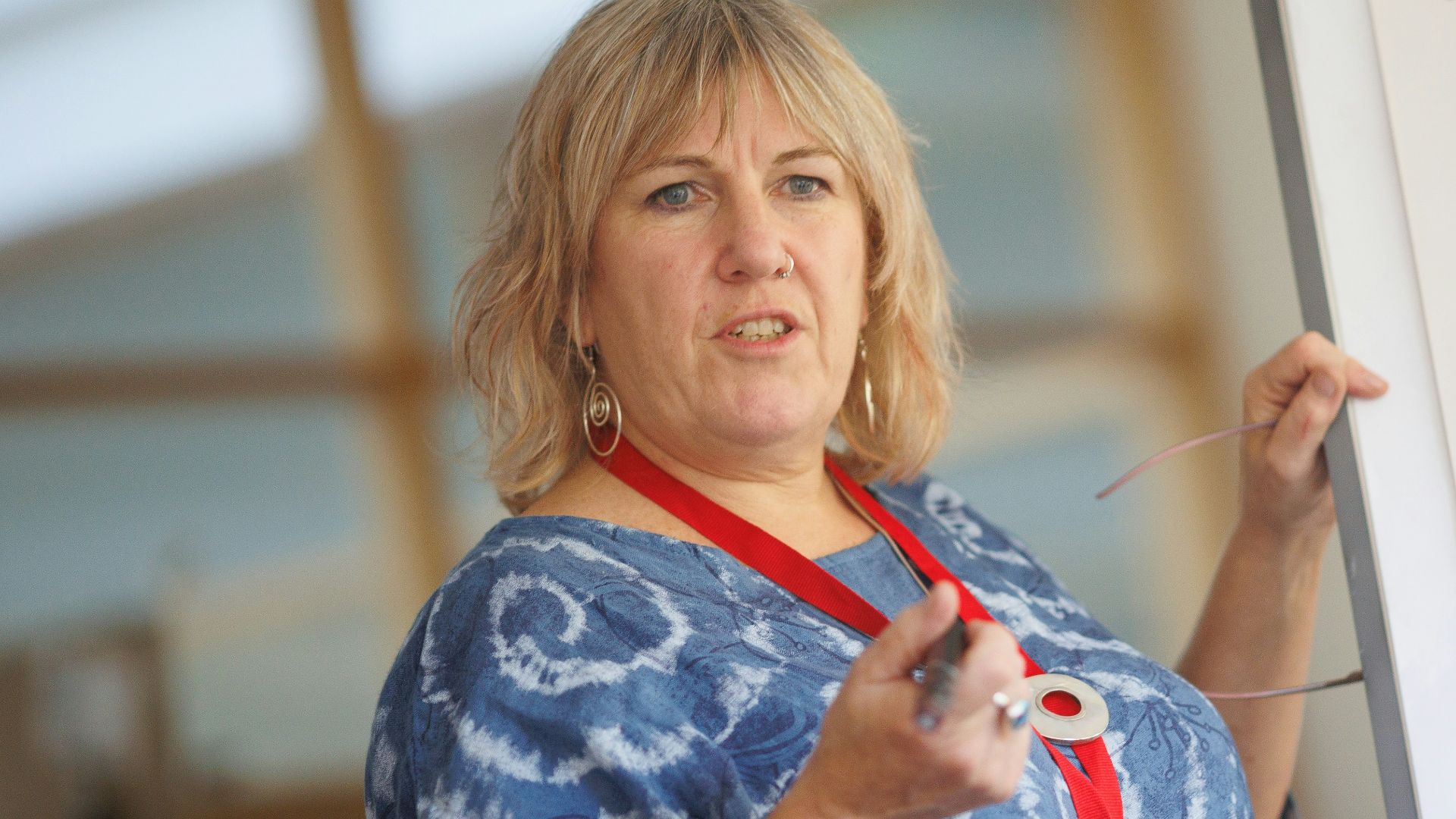 a person writing on a whiteboard