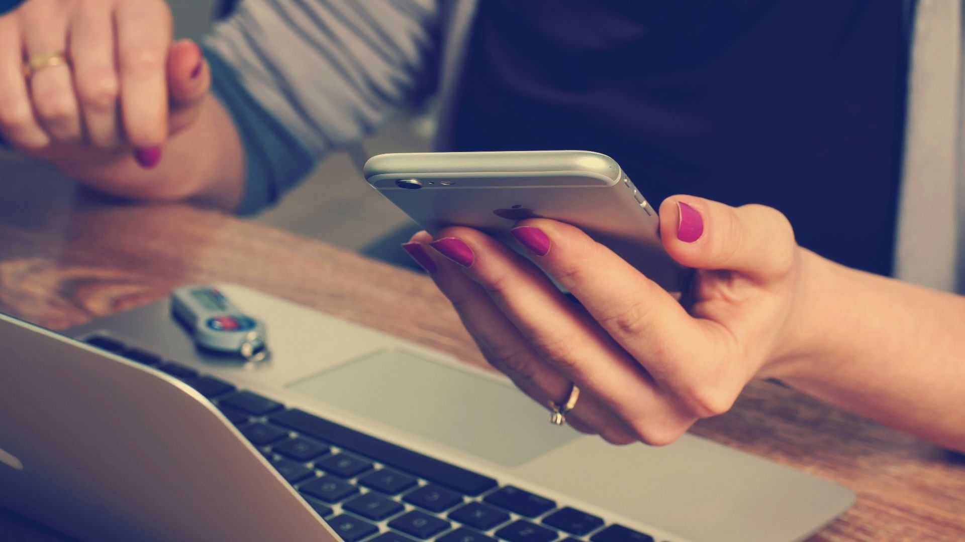 woman holding silver iPhone 6