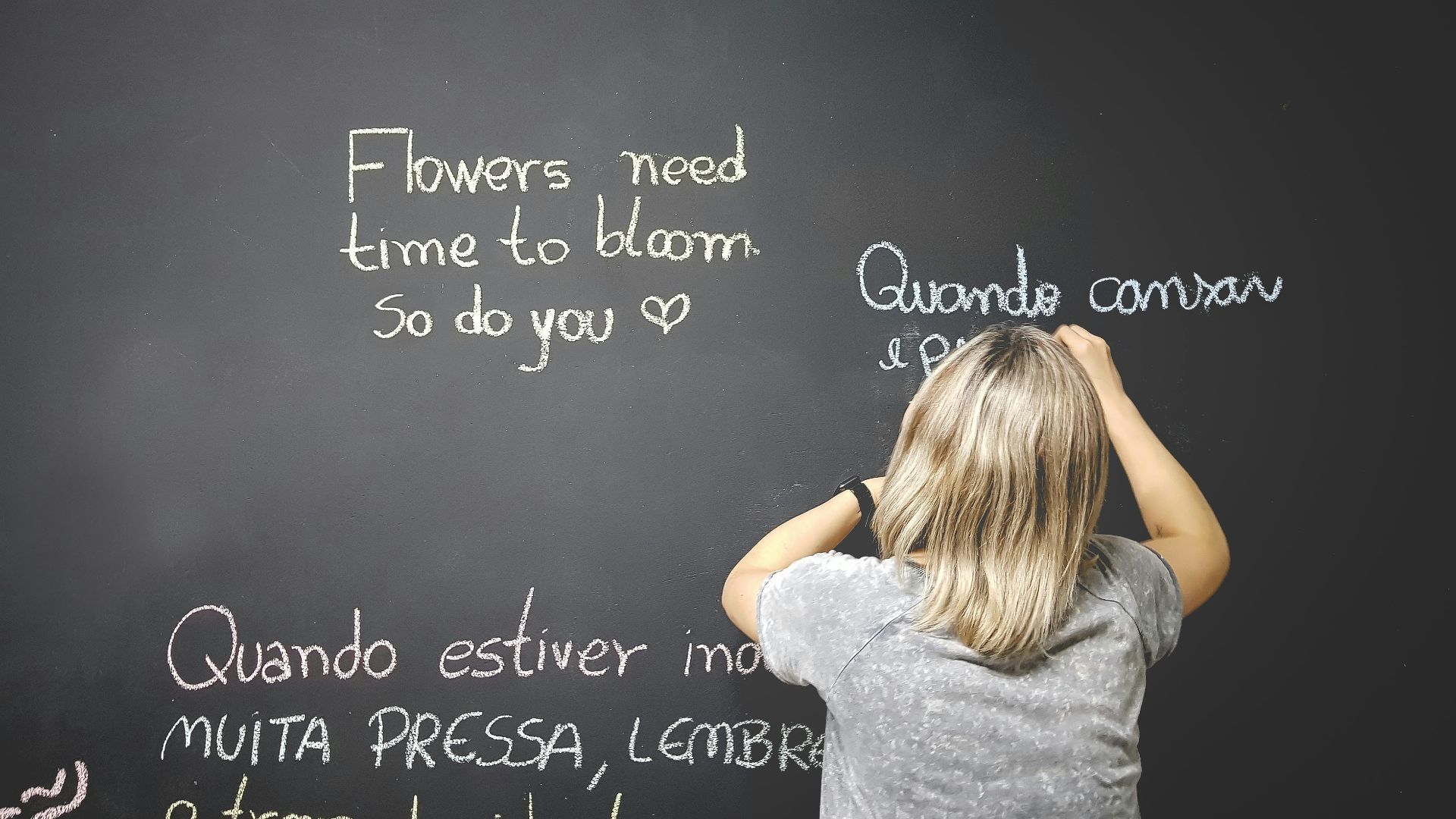 unknown person writing on chalkboard