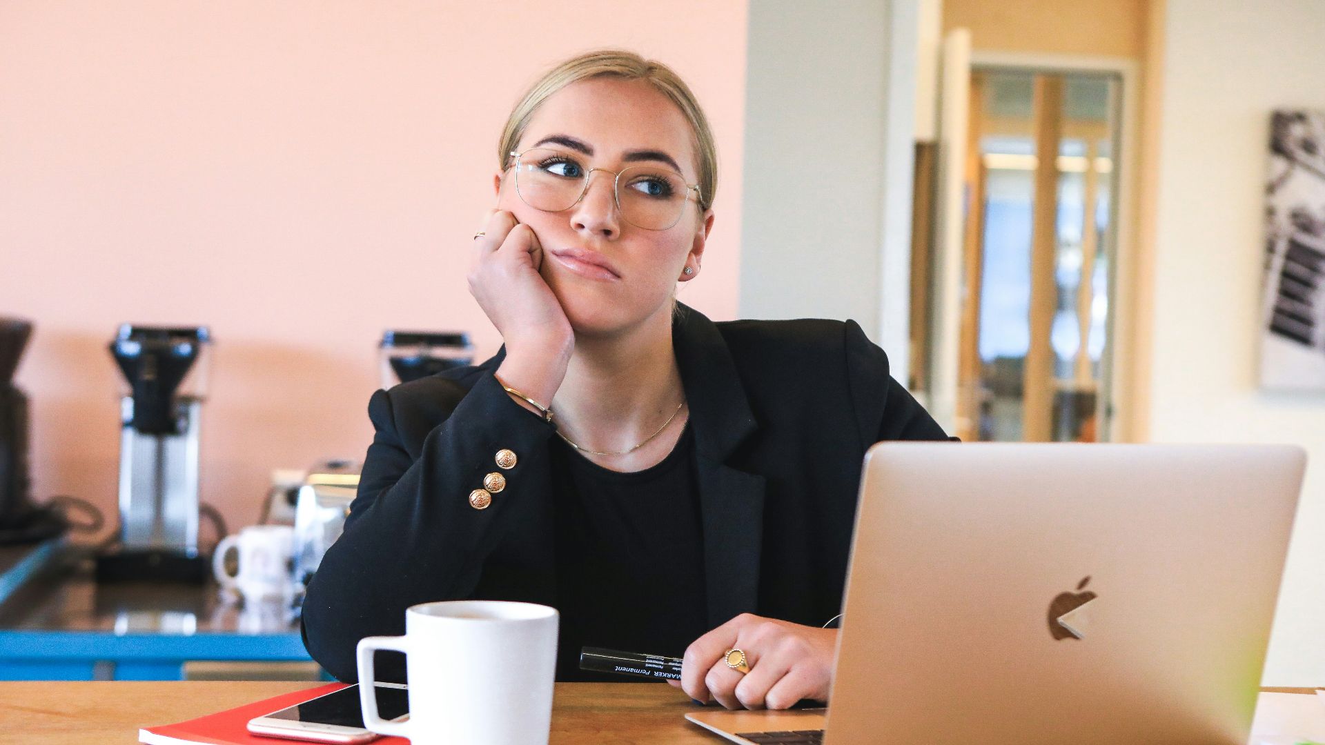 woman in black long sleeve shirt using macbook