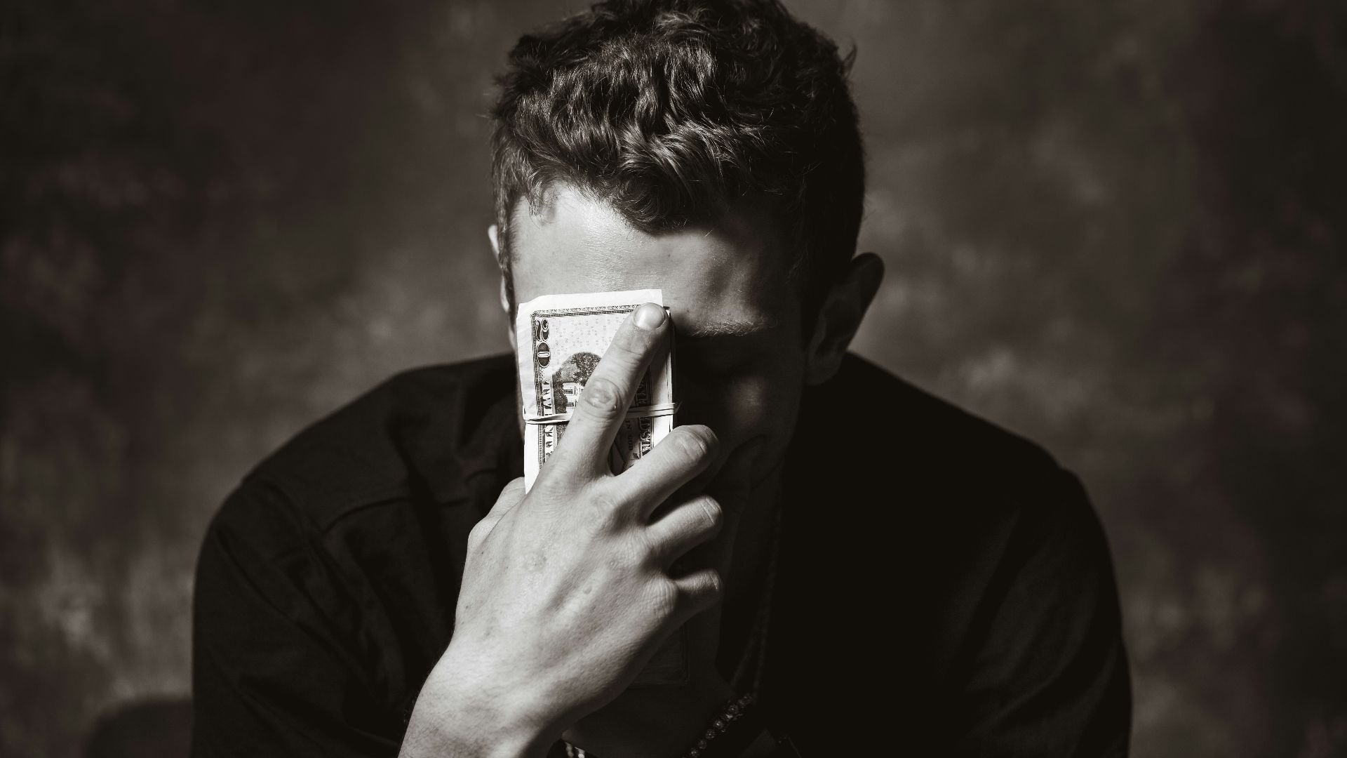 man holding banknote