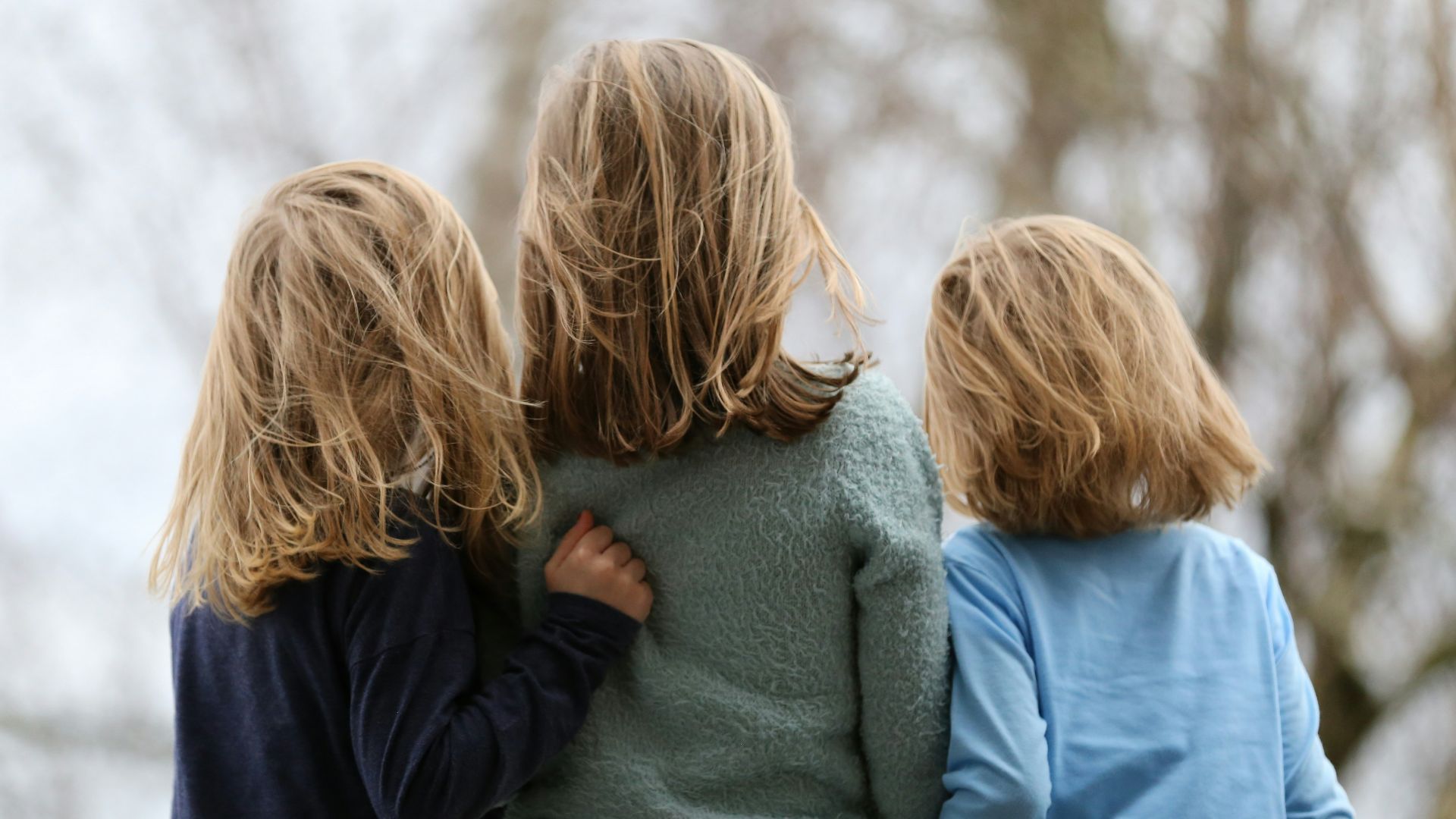 2 women in blue and gray sweaters