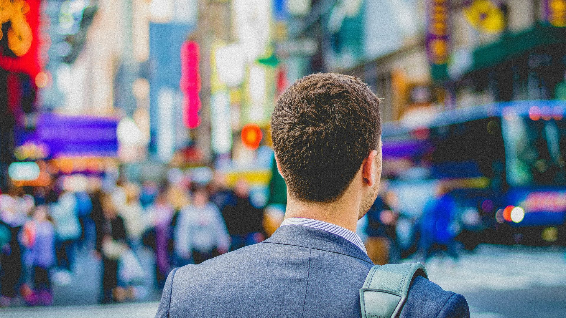 shallow focus photography of man in suit jacket's back