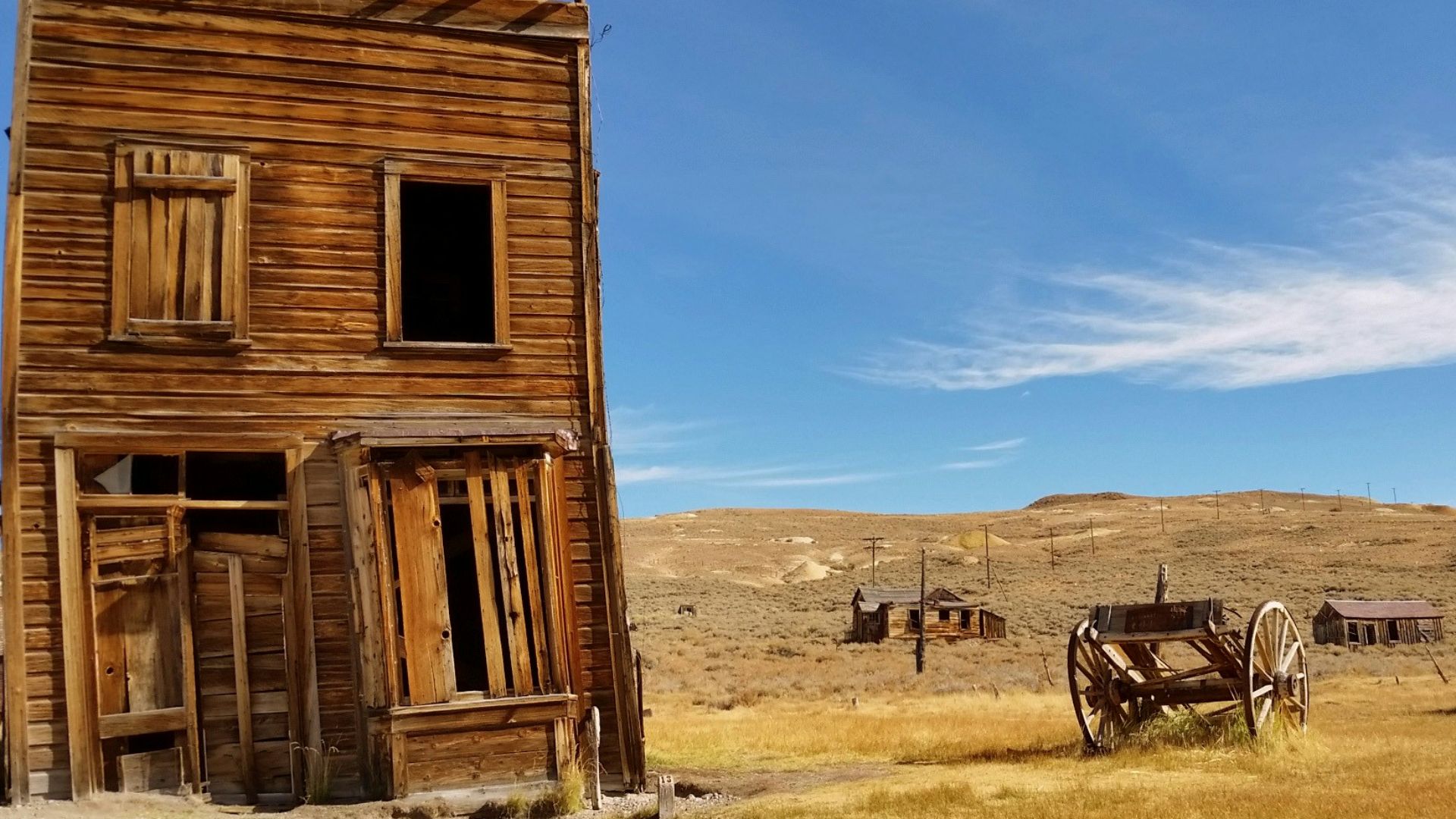 brown 2-storey house near wagon