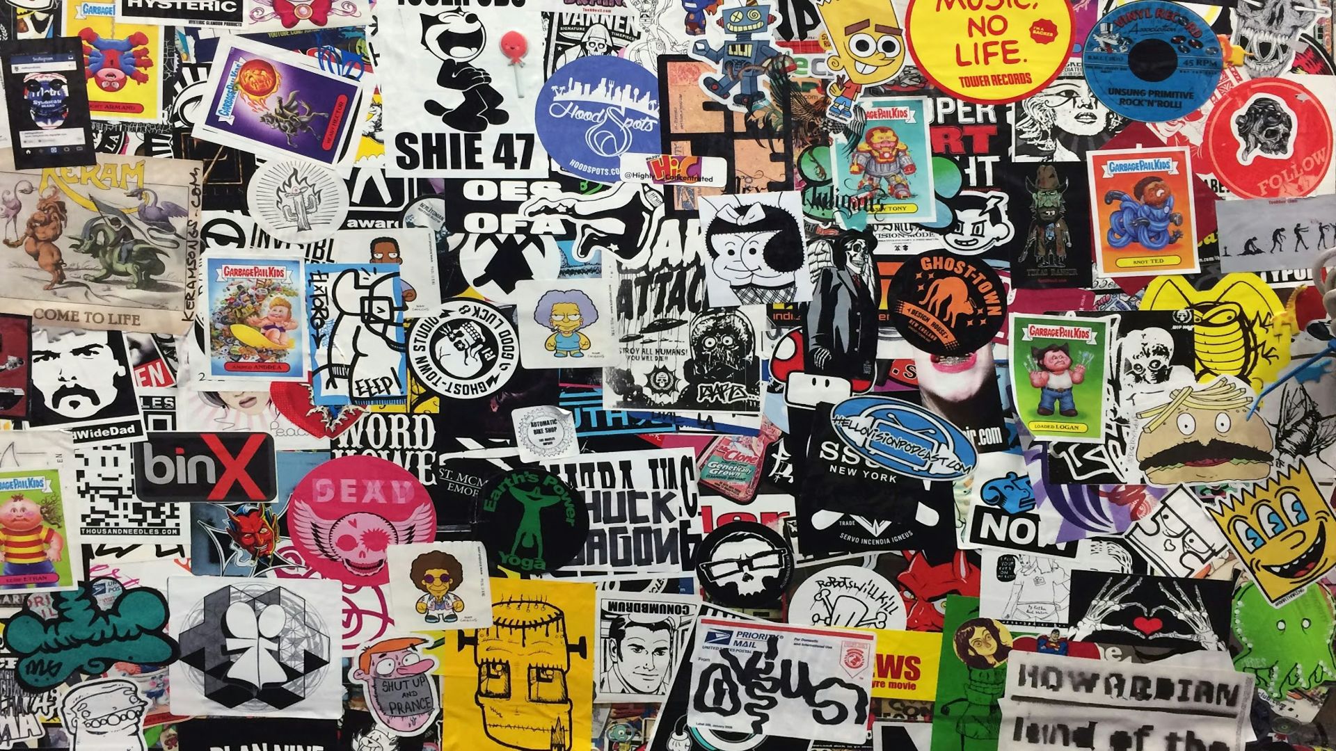 assorted stickers on white wall