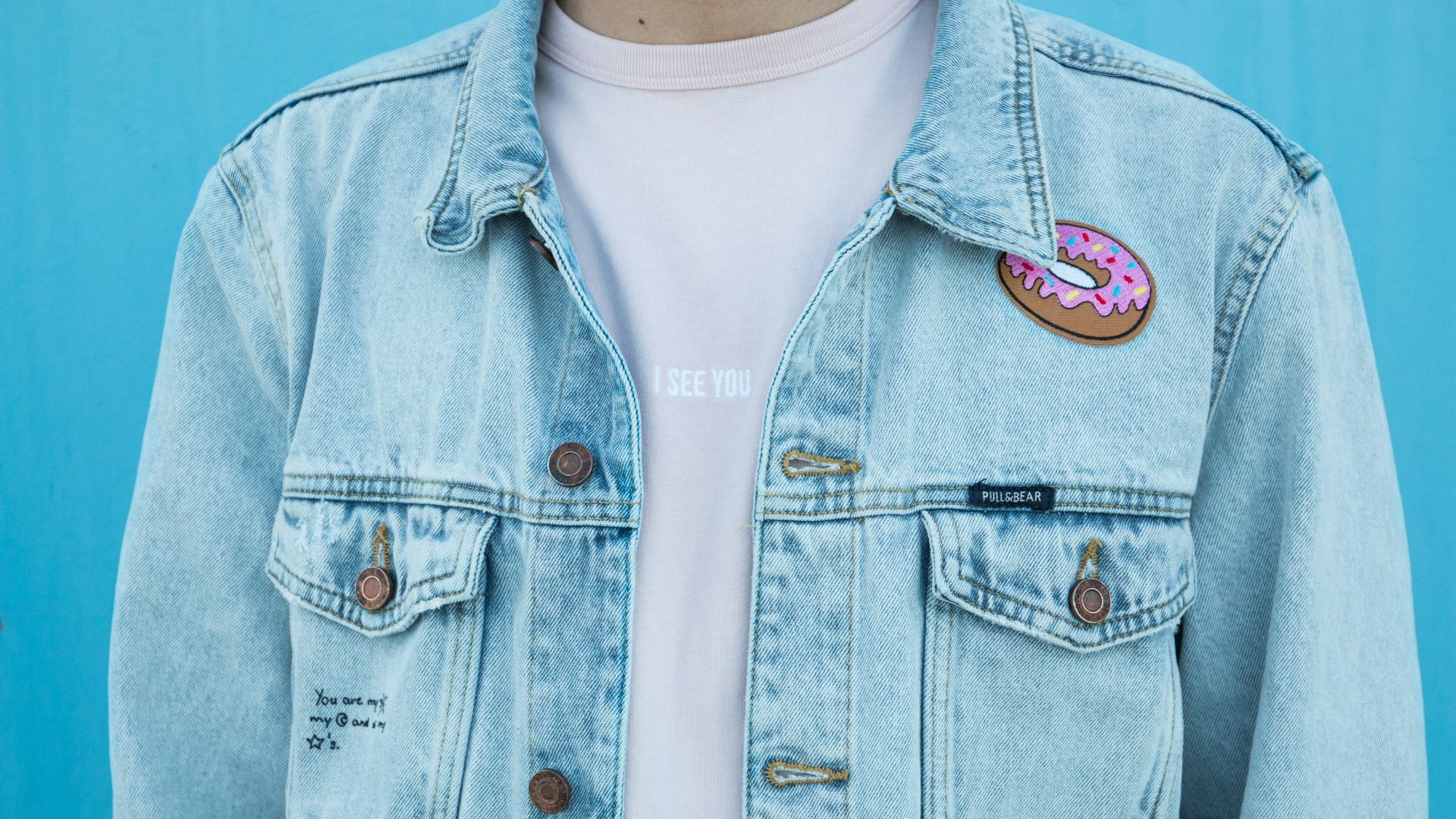close shot of person denim top