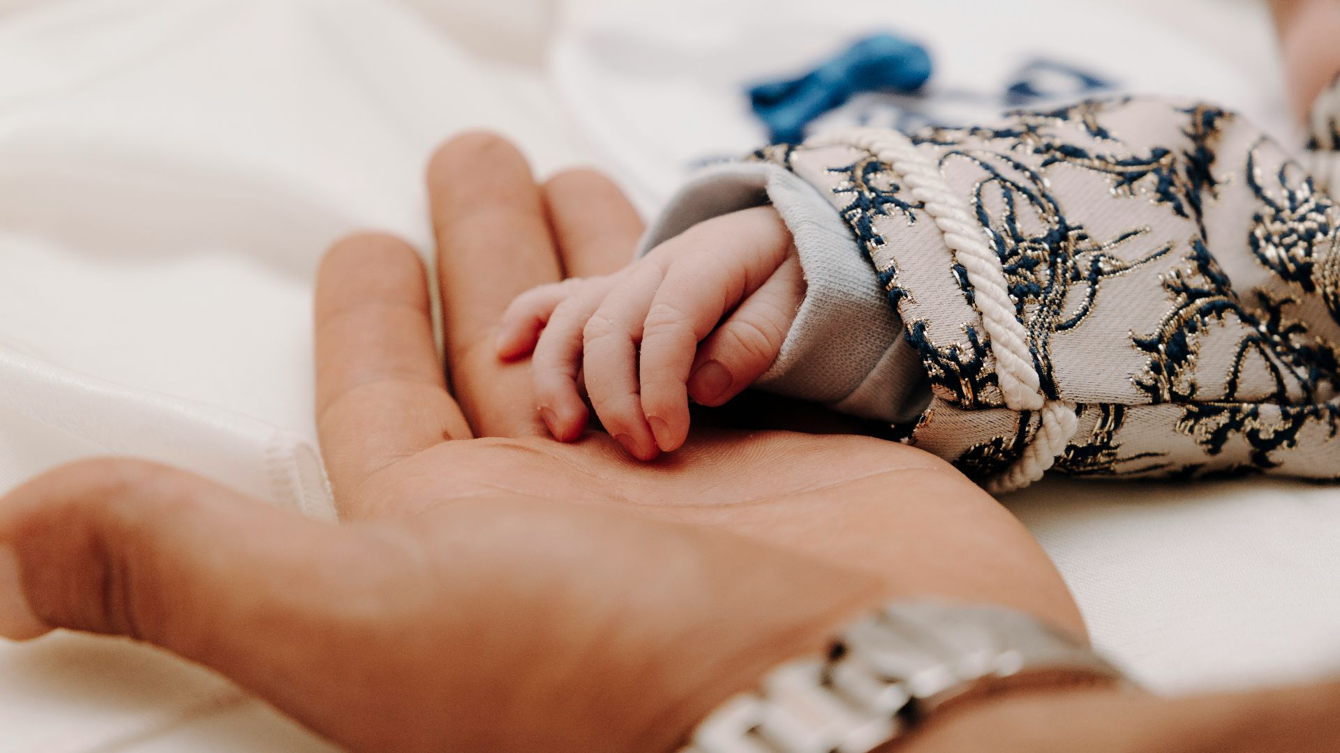 person wearing silver link bracelet