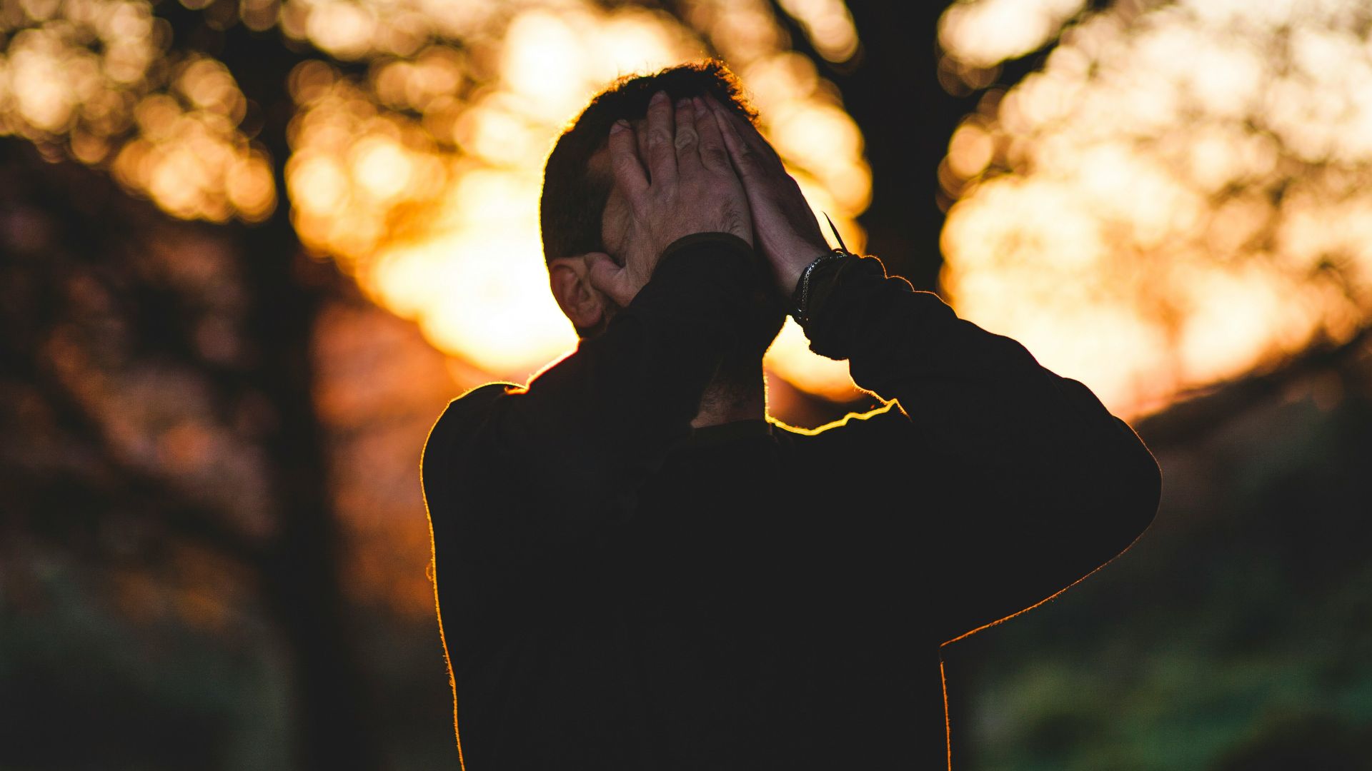 man wearing black long-sleeved shirt