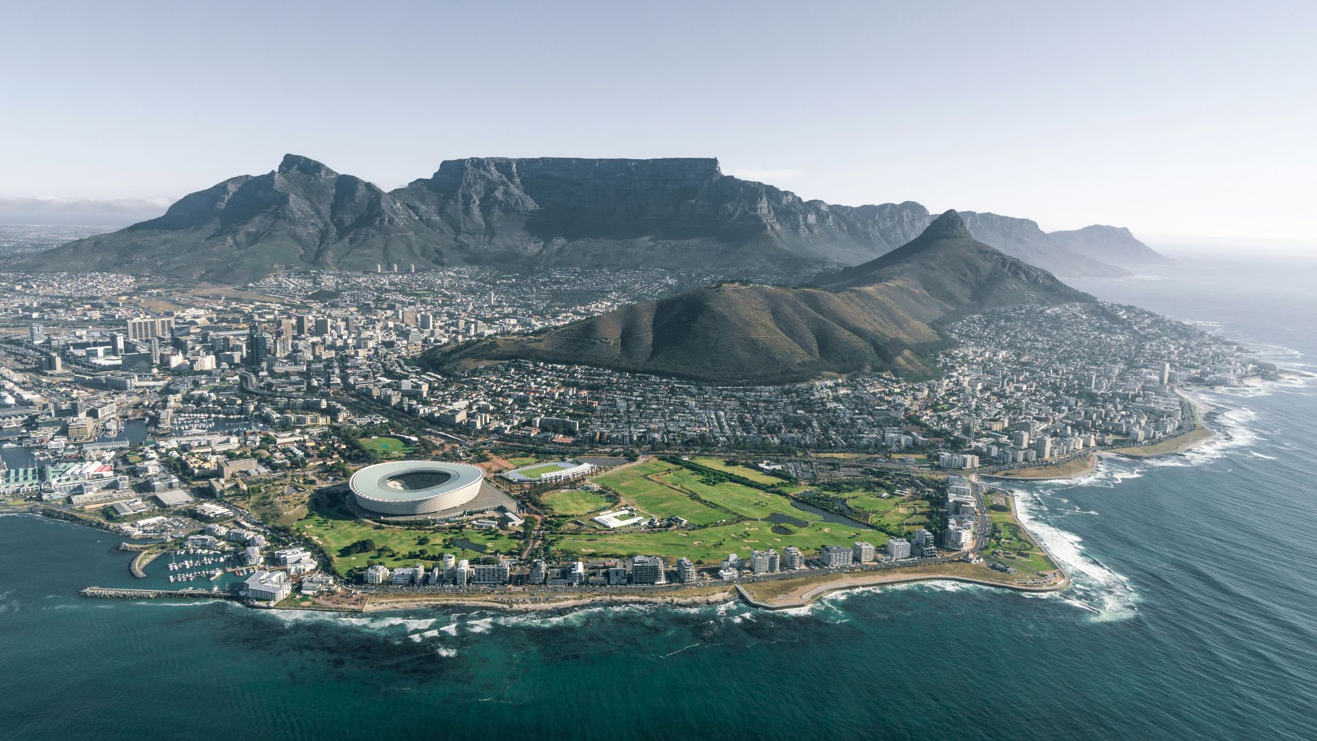 aerial view of city near mountain during daytime