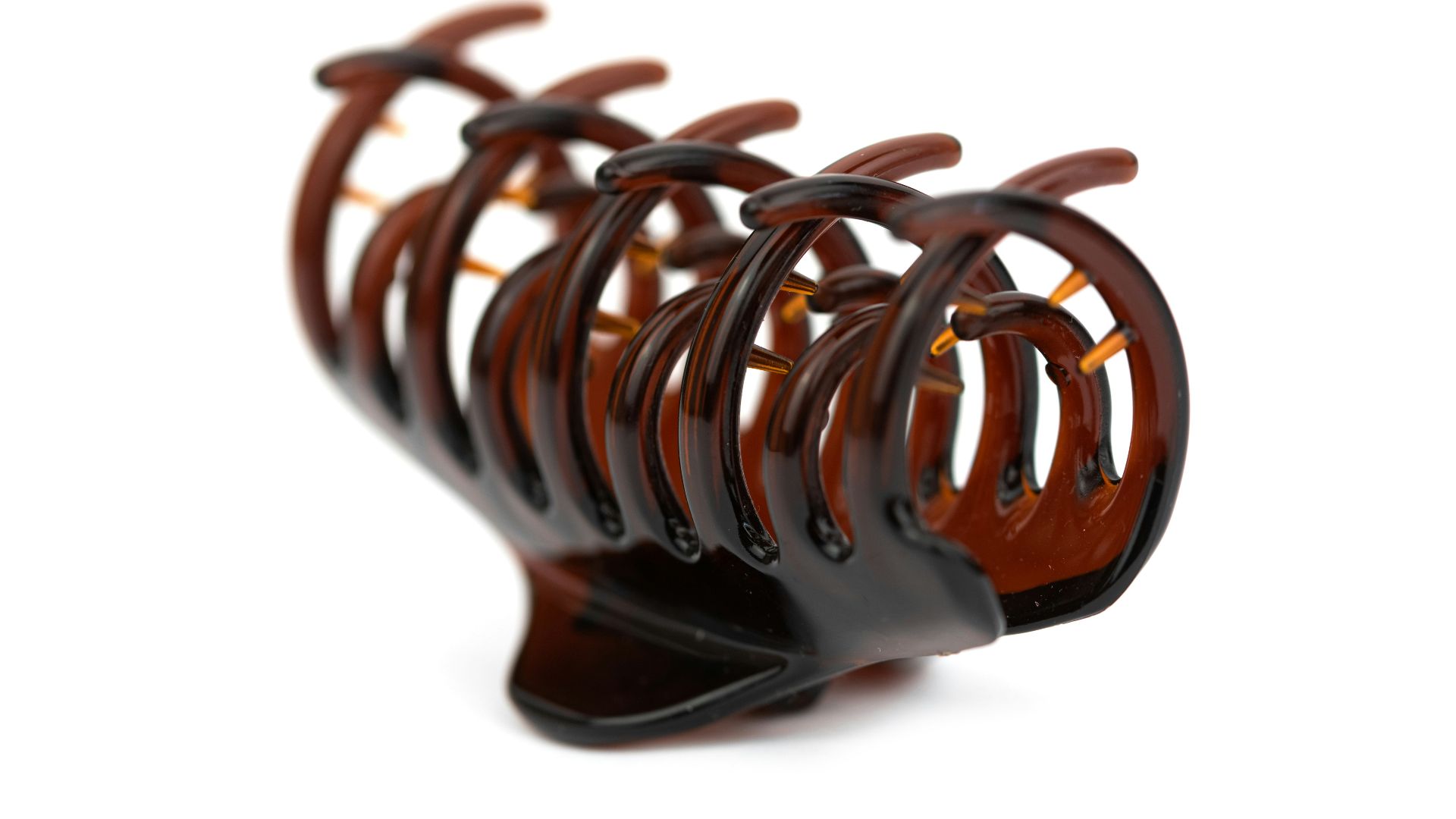 a close up of a wooden object on a white background