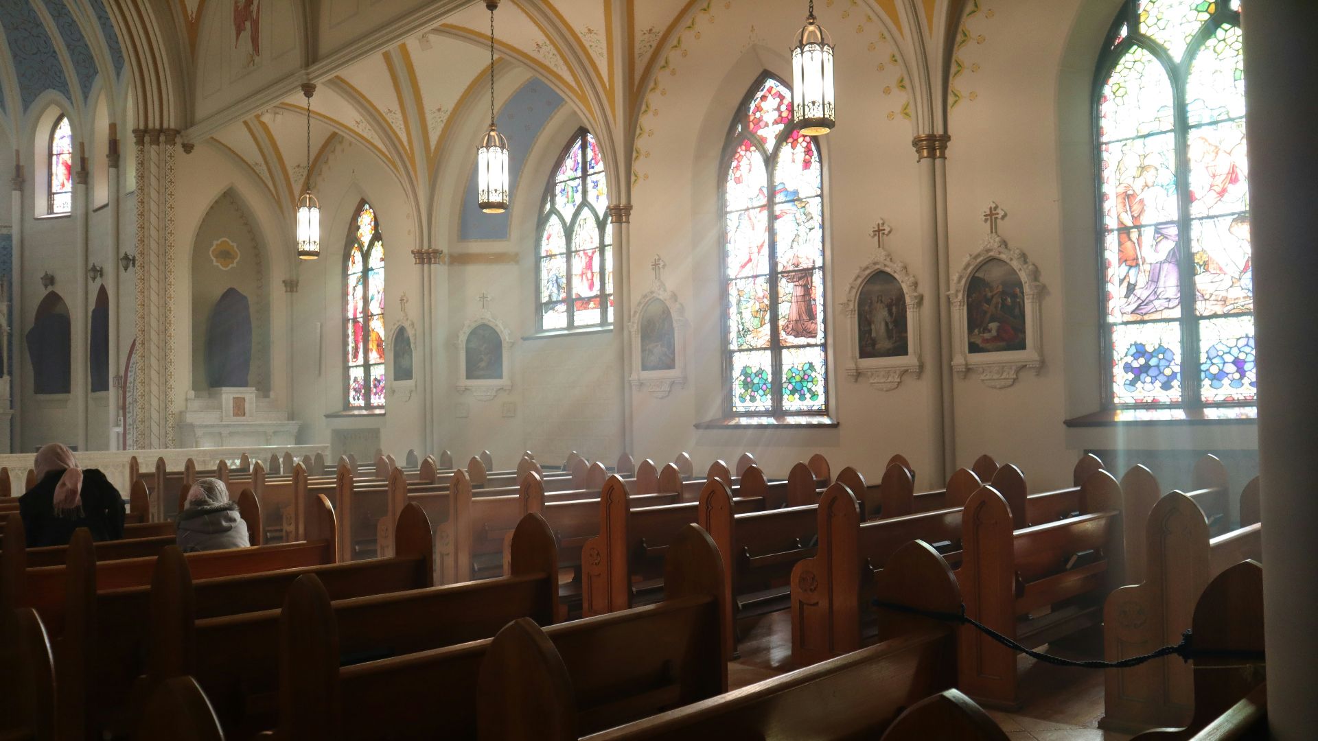 brown wooden chairs inside church