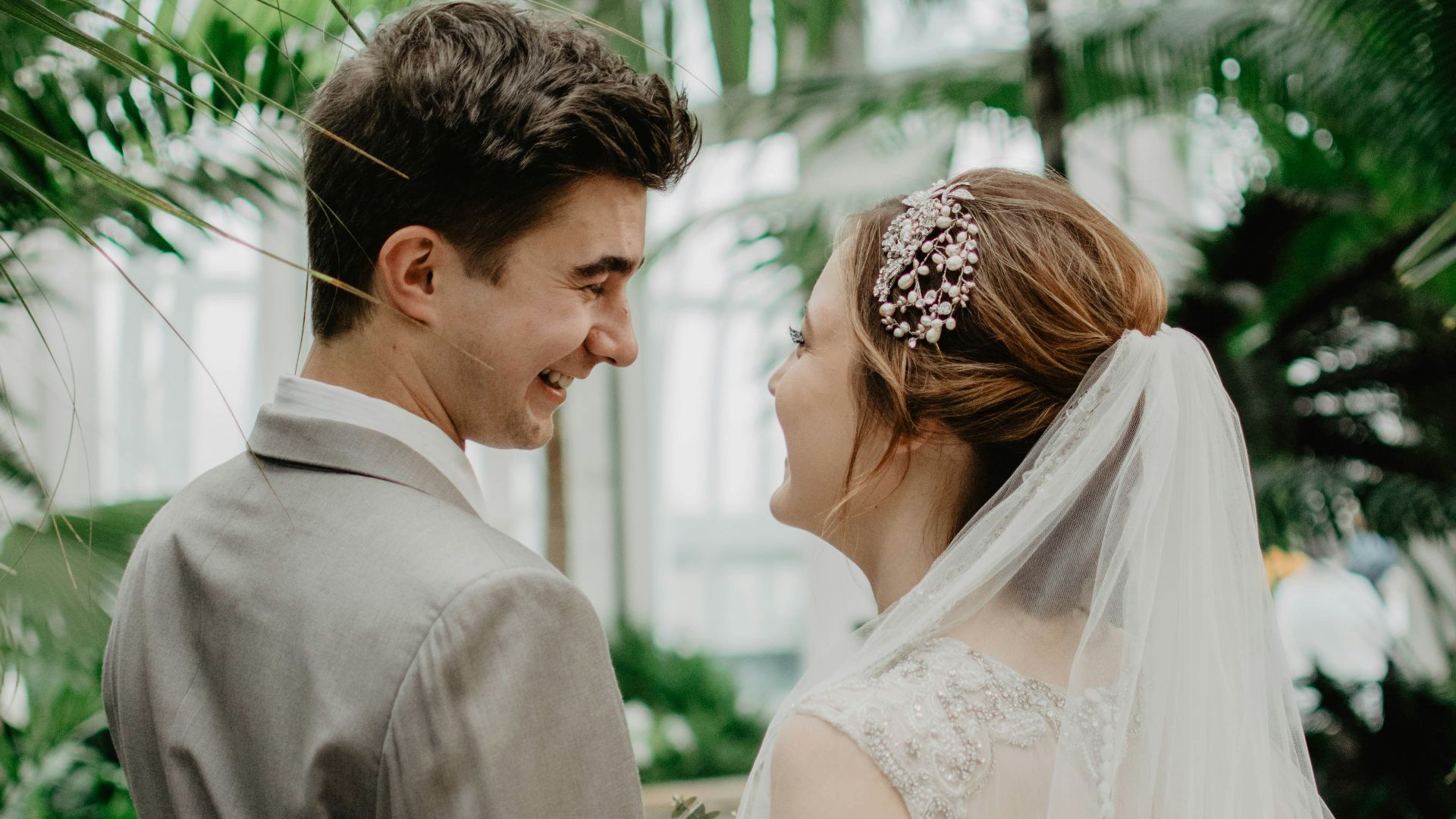 bride and groom surrounded by plants