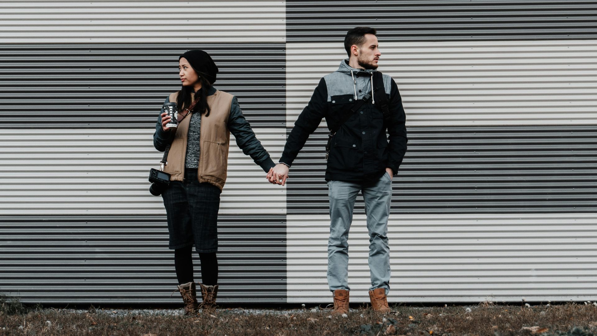 man and woman holding each other's hands