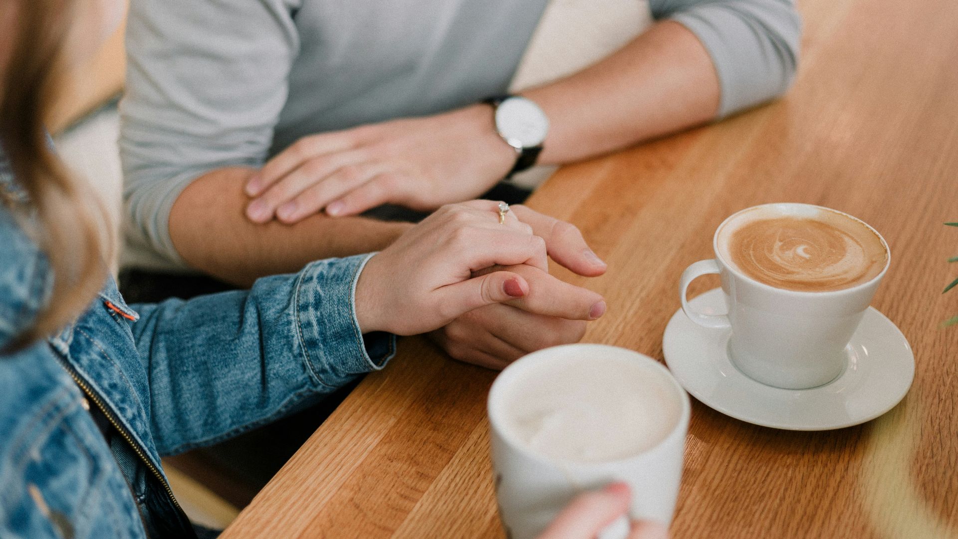 man and woman holding hands