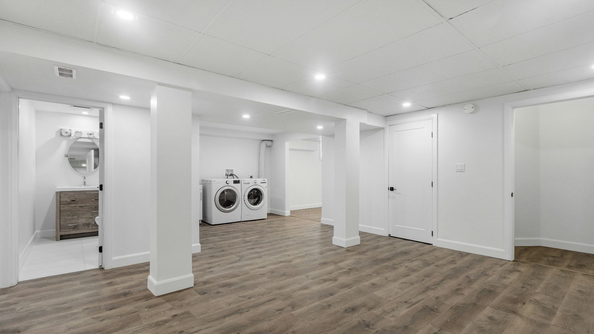 an empty room with a washer and dryer