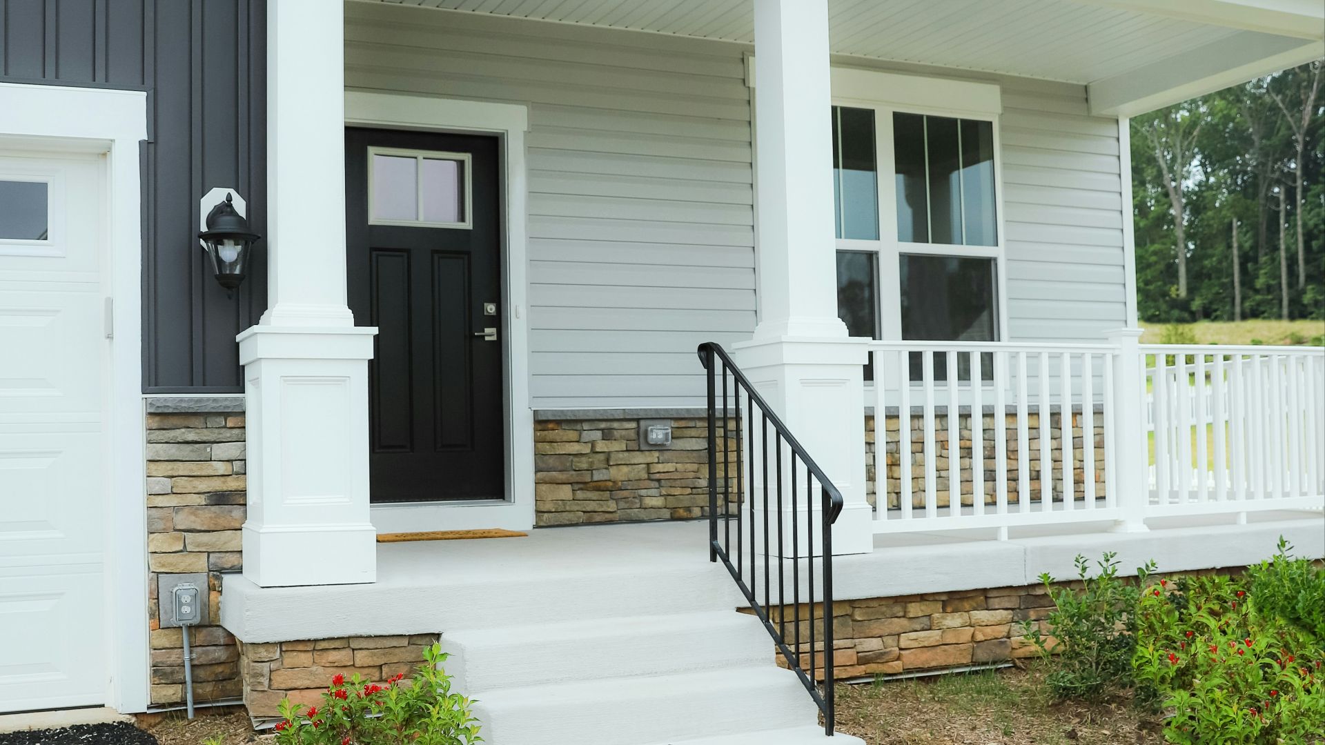 a white house with a black front door