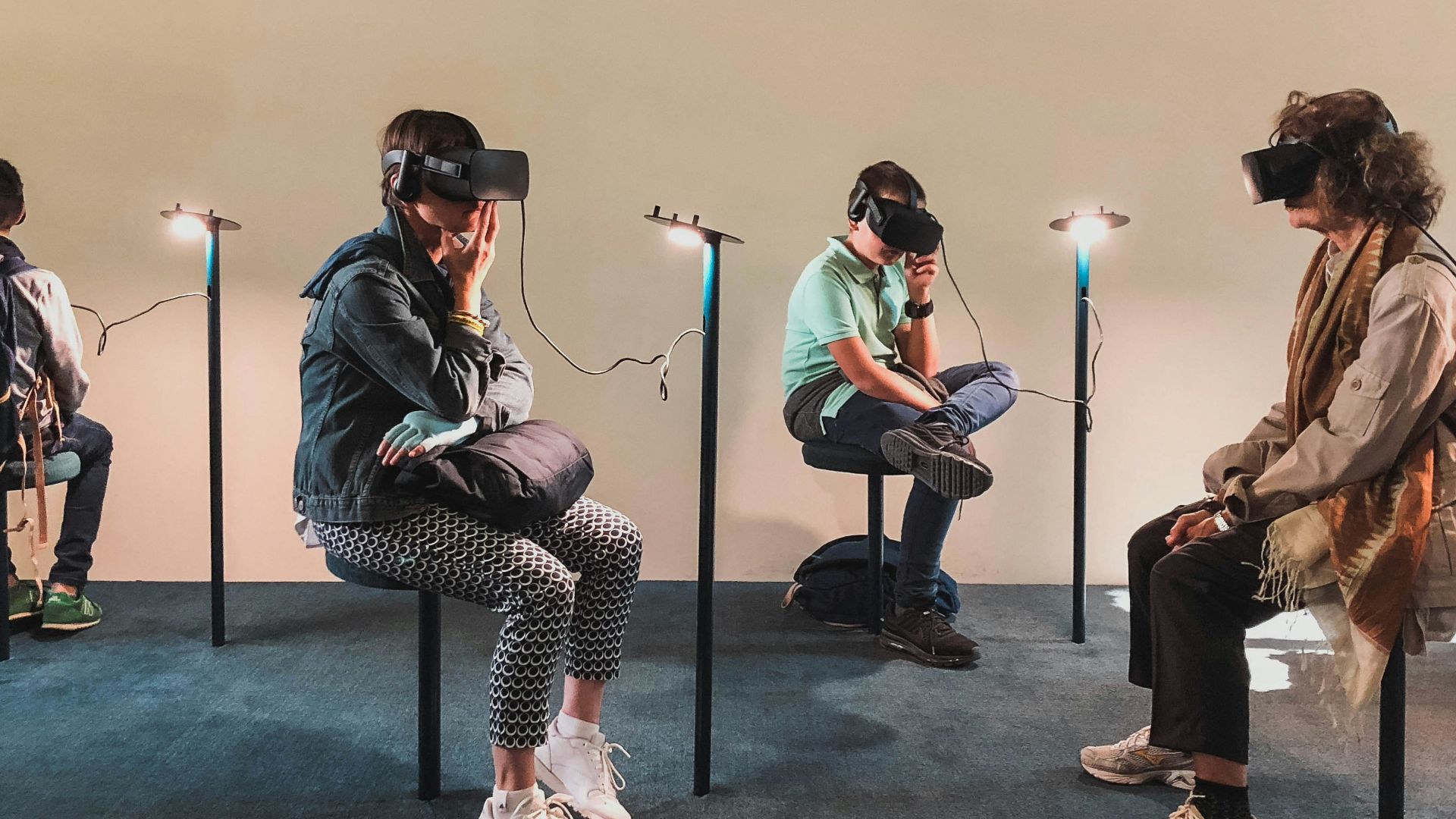 four person playing virtual reality goggles