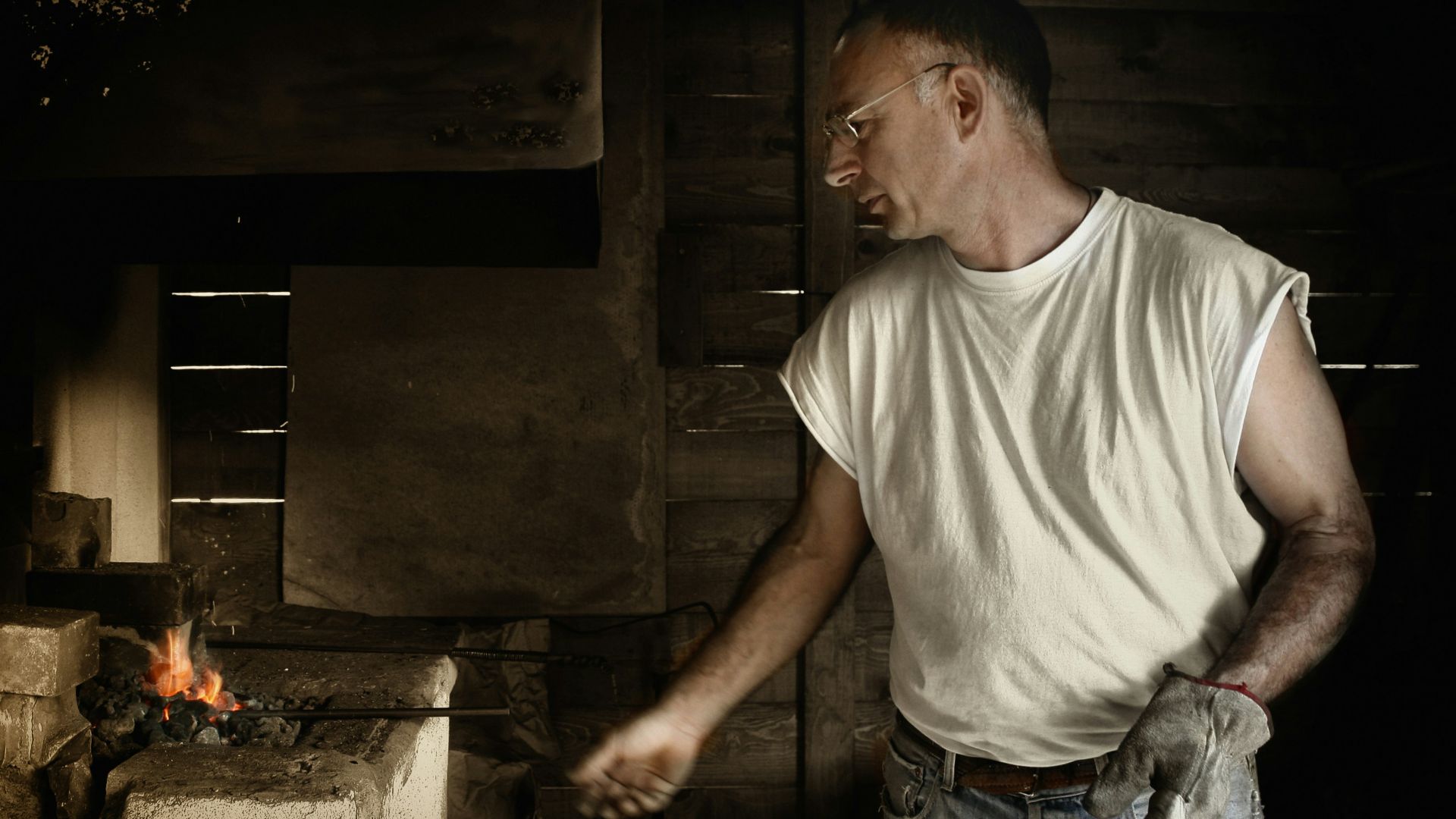 man standing near burner