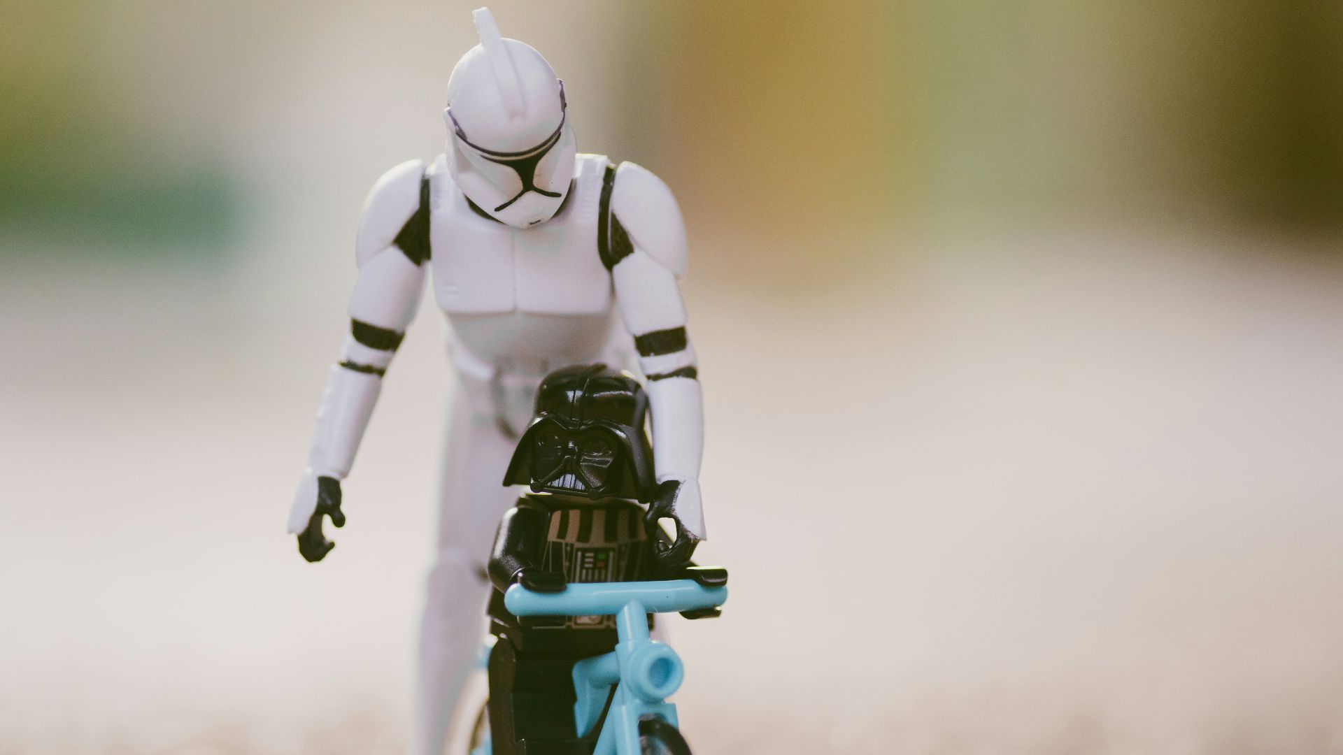 lego minifig riding on bicycle