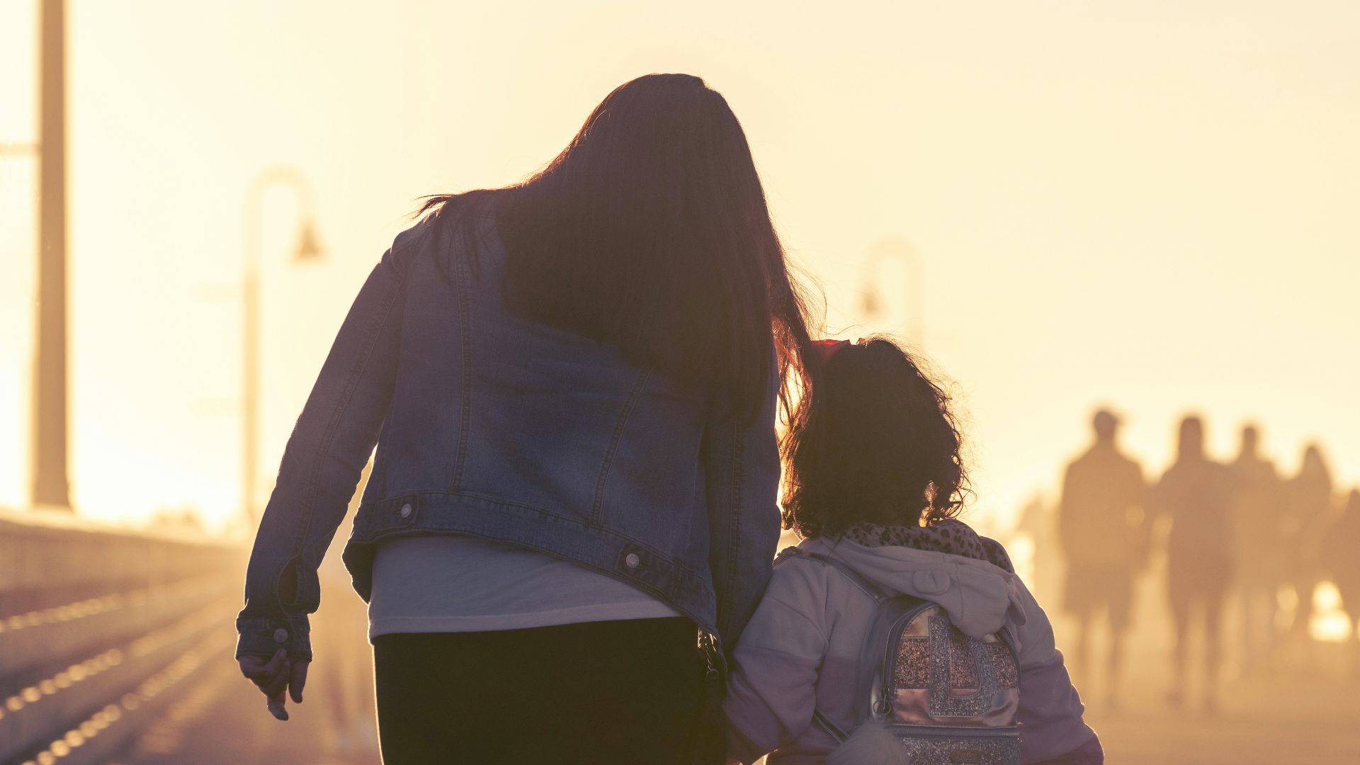 2 women walking on the road during daytime