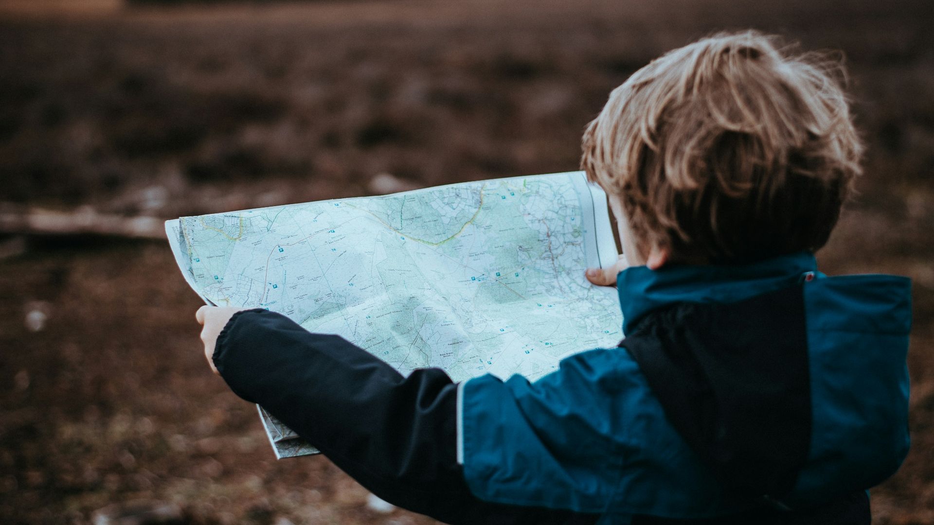child looking at map