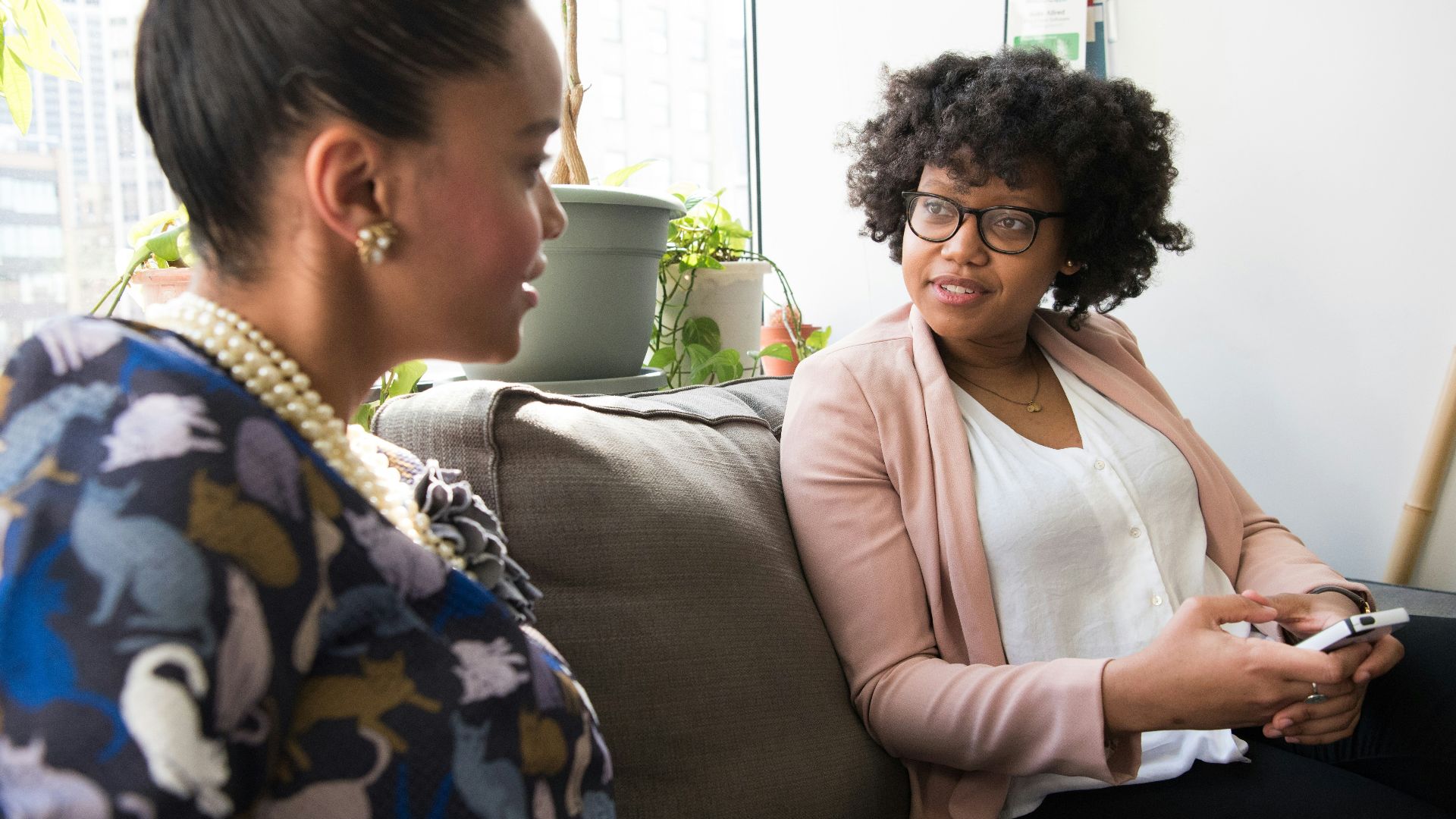 shallow focus photo of woman in beige open cardigan