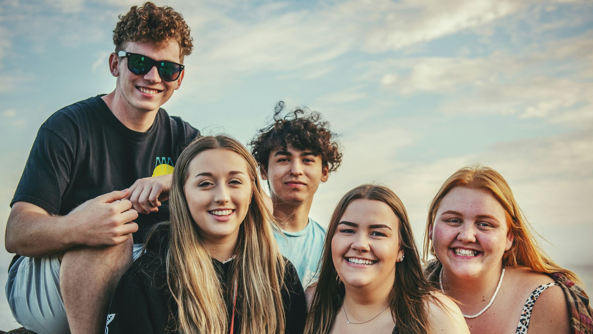 photography of five people near outdoor during daytime
