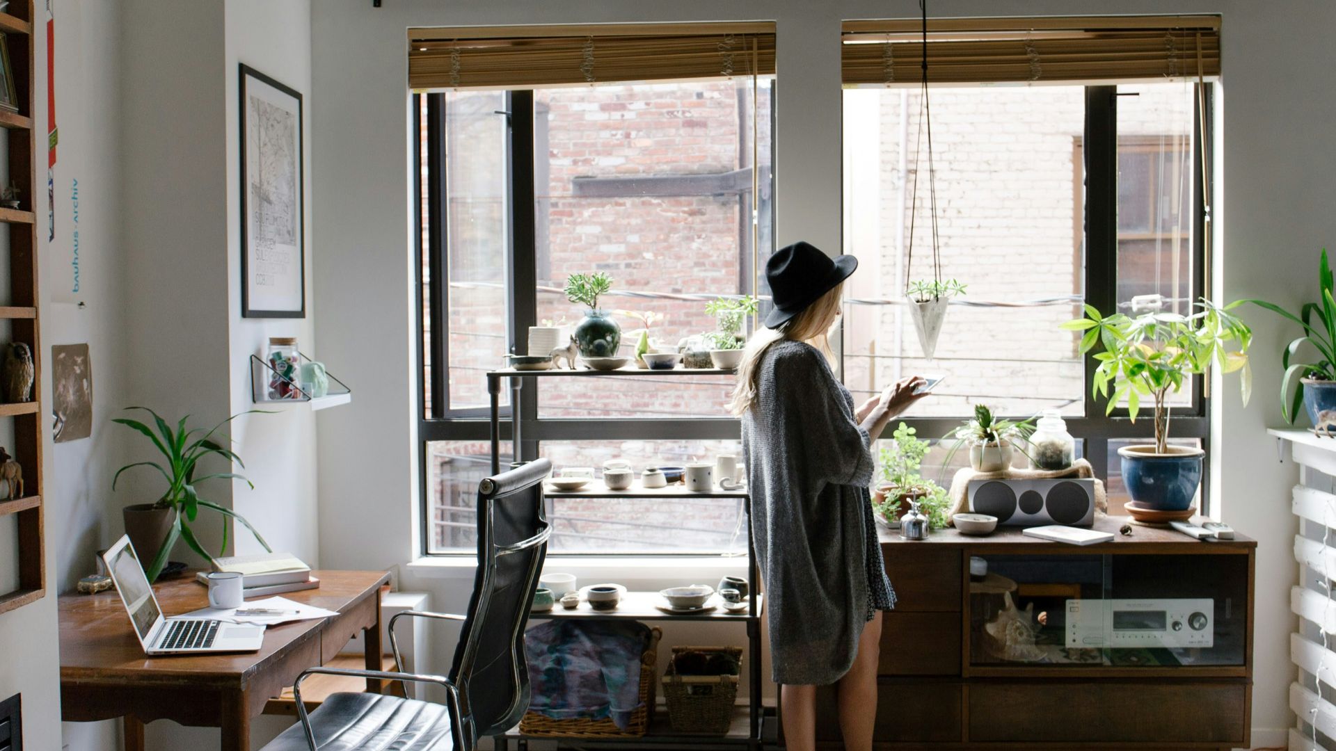 woman standing near brown wooden cabinet