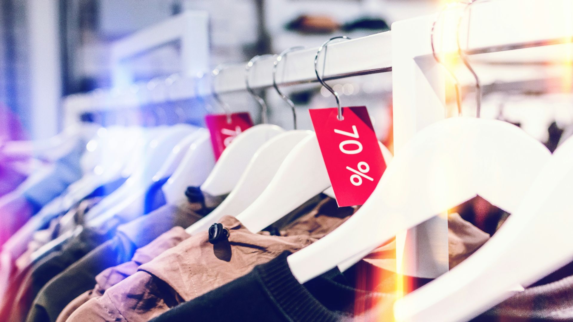 person holding white plastic clothes hanger