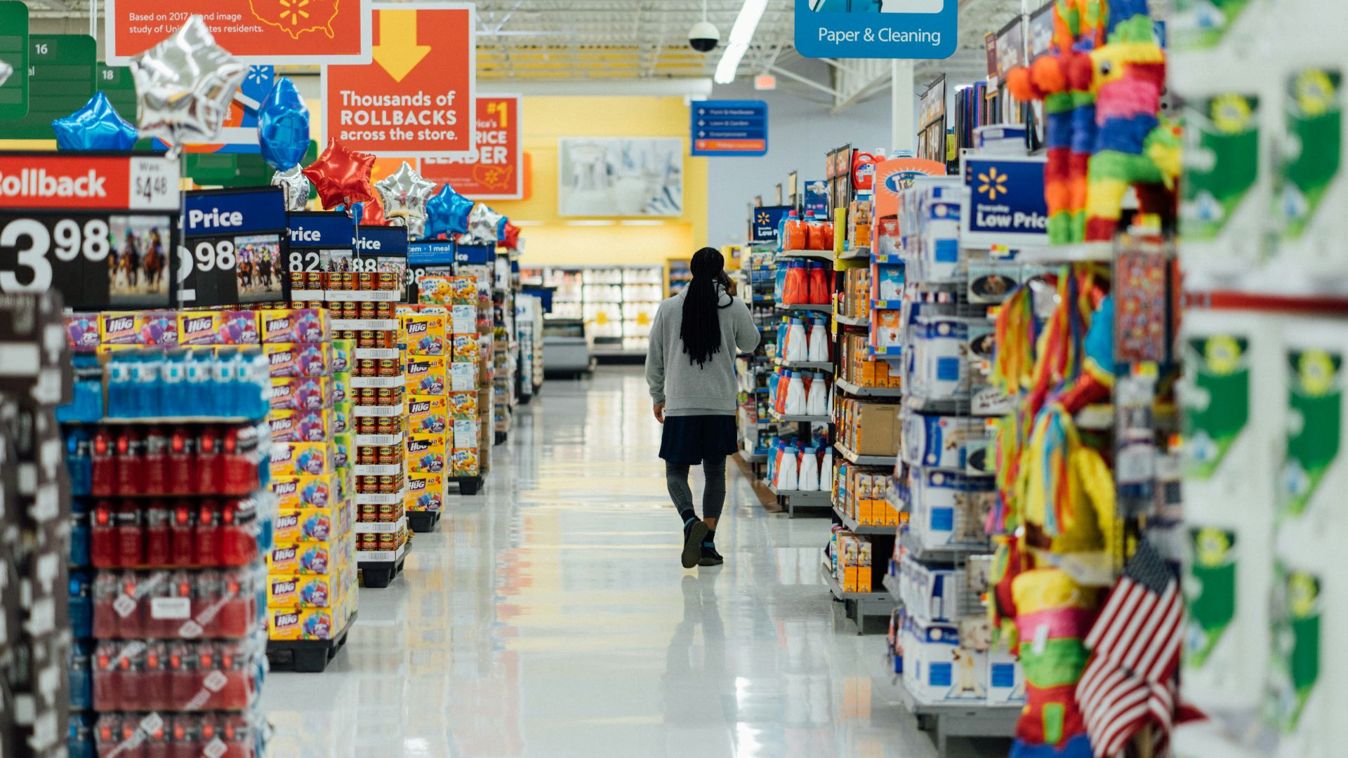 person standing between shelvings